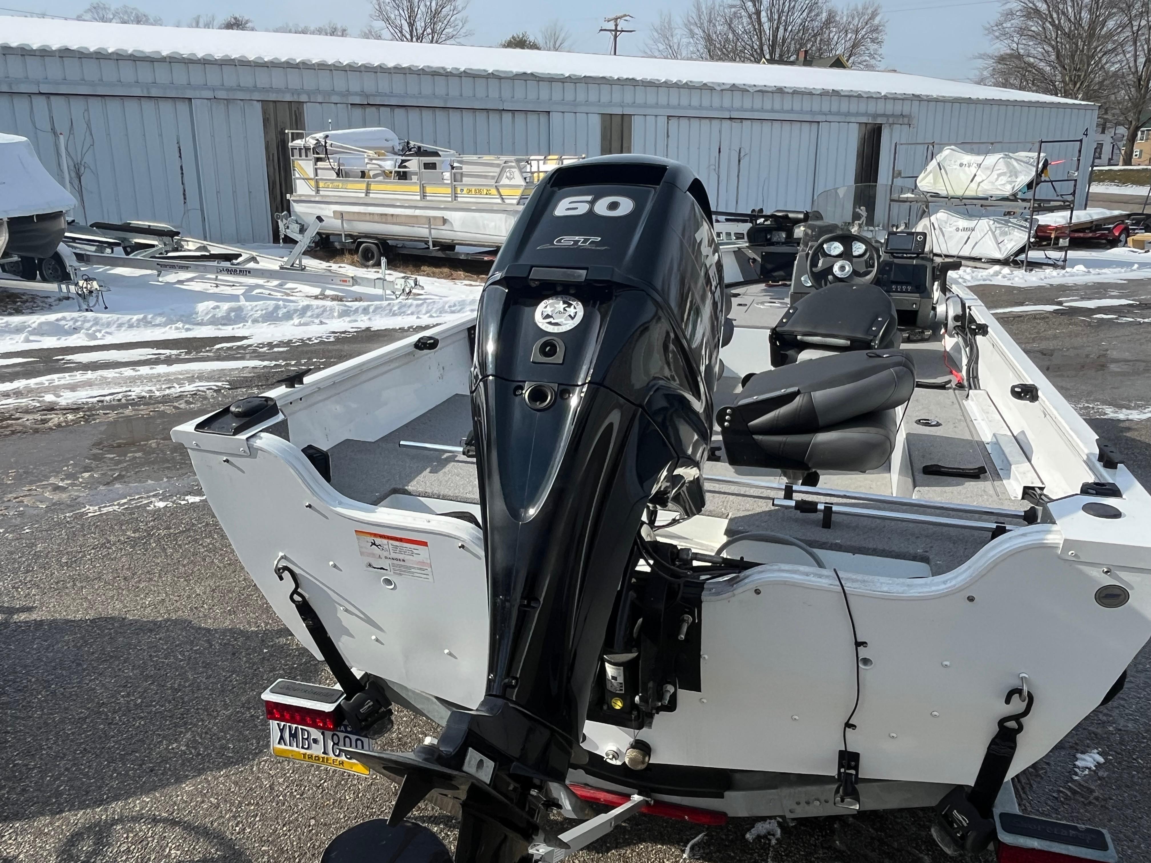 2020 Crestliner 1800 Kodiak SC boat with 60 HP outboard motor in snowy setting.