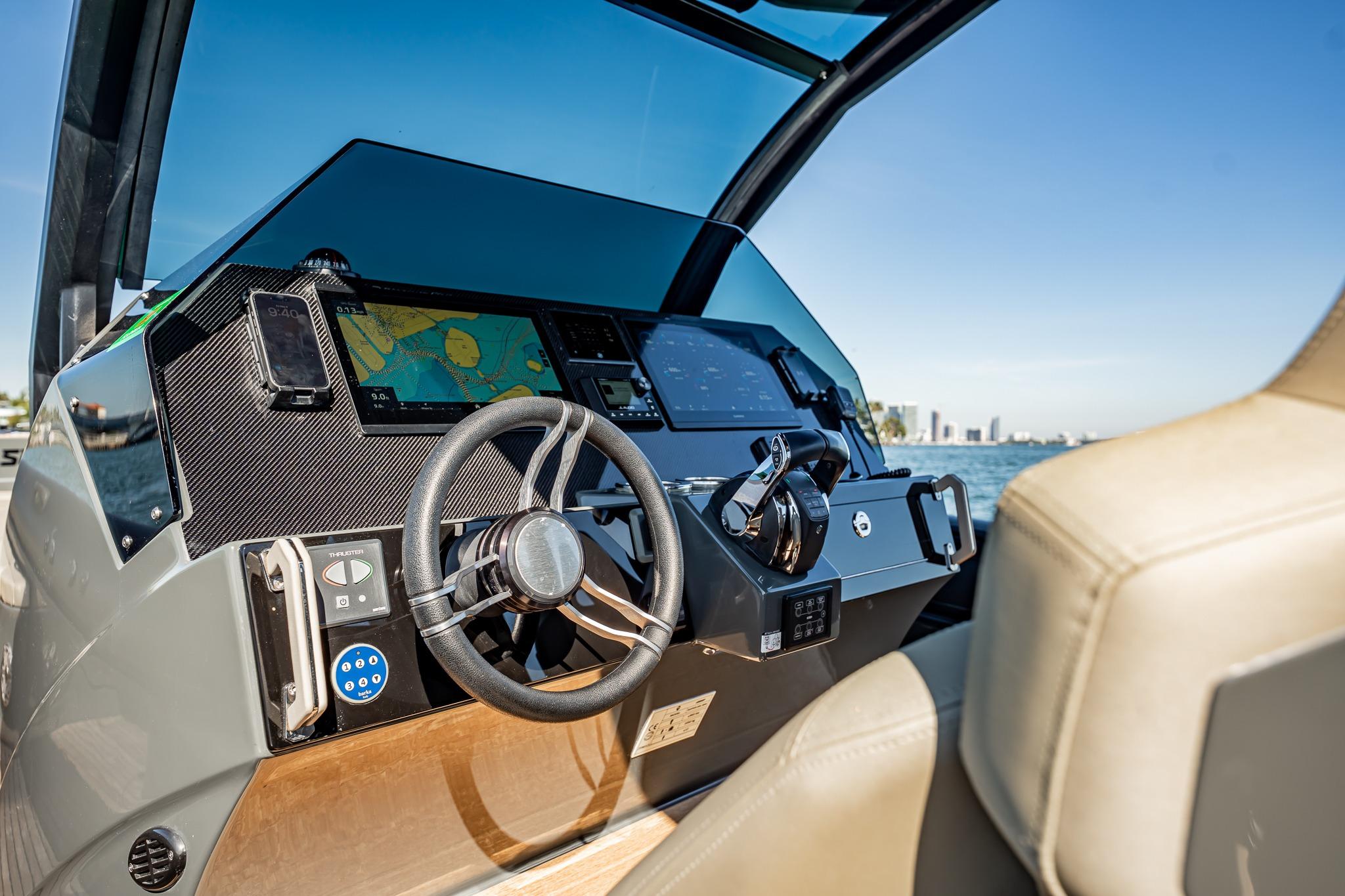 2023 Skipper-BSK 38NC boat dashboard with navigation system and steering wheel.