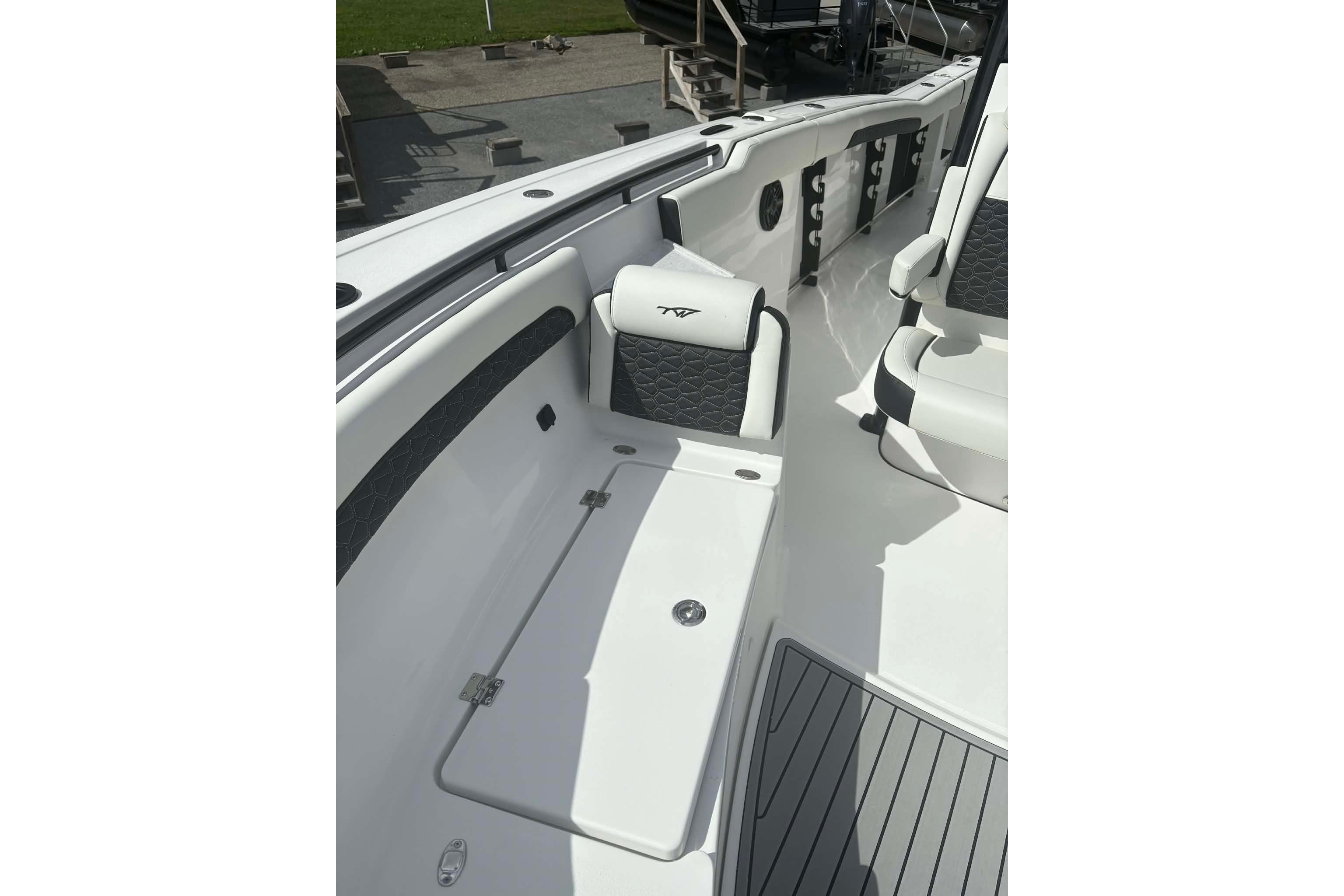 2026 Tidewater 282 CC Adventure boat interior with seating and storage compartments.