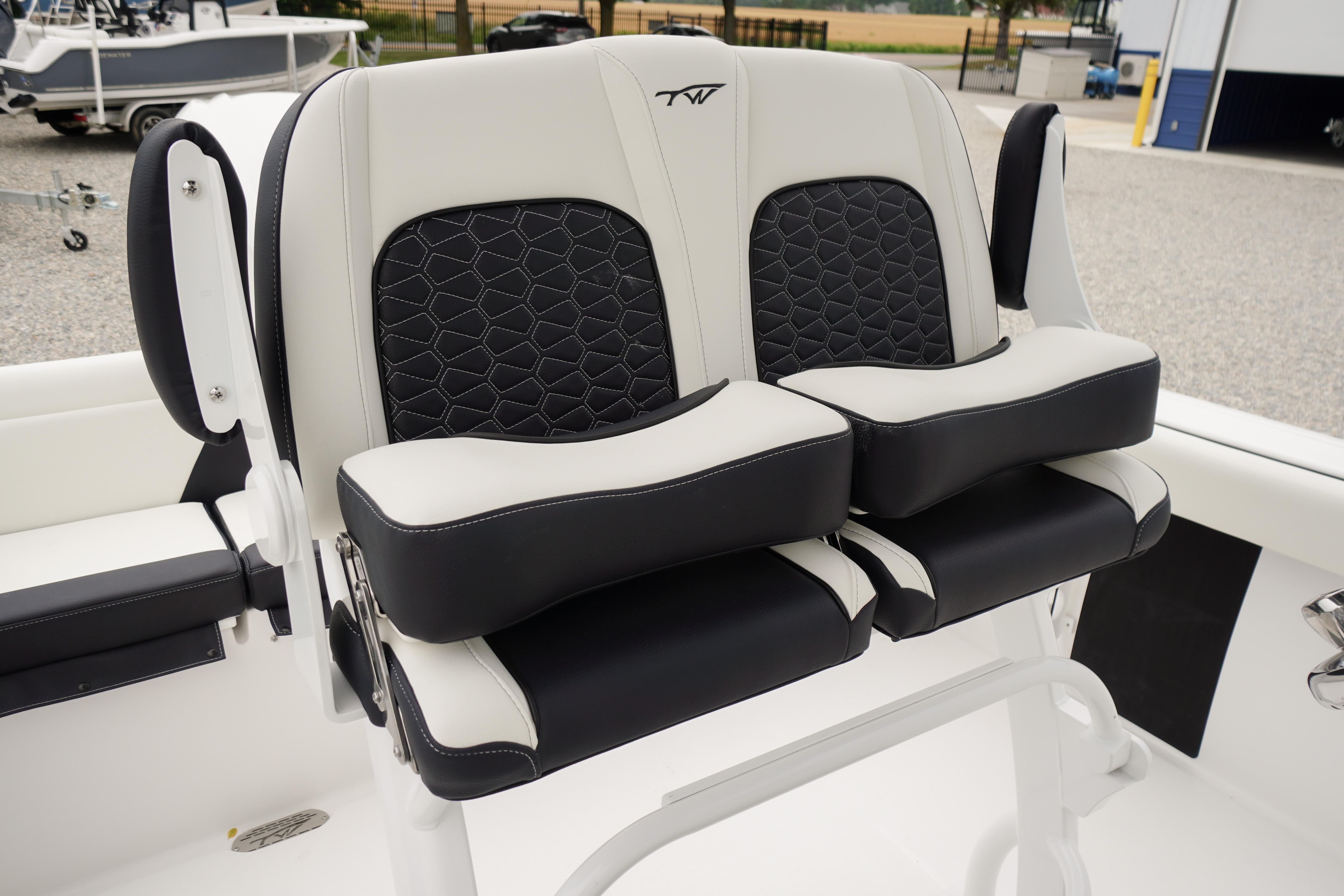 2026 Tidewater 232 SS boat seats with black and white upholstery, featuring modern design.
