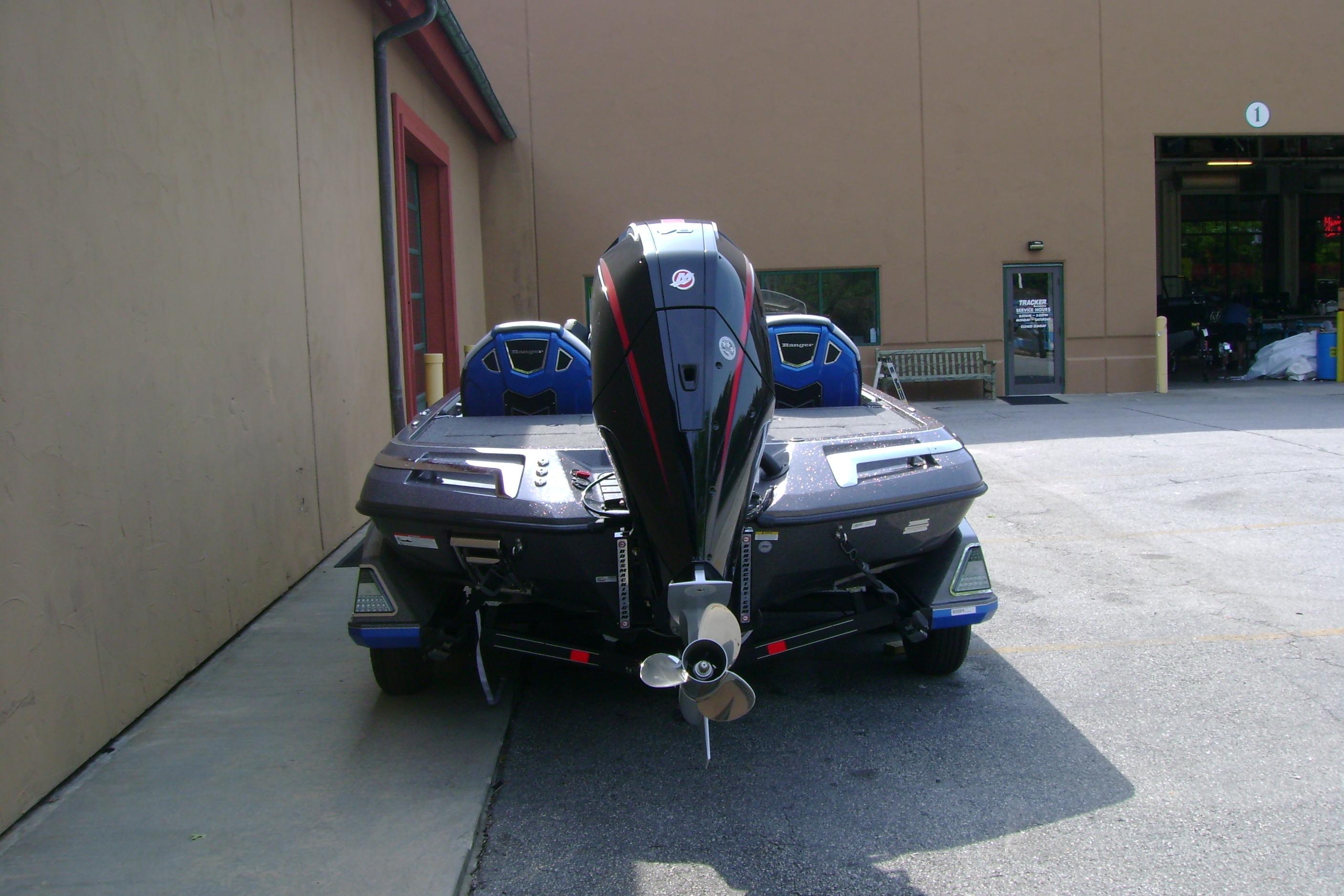 2026 Ranger Z519R Cup-Equipped boat, rear view, parked outside a building.