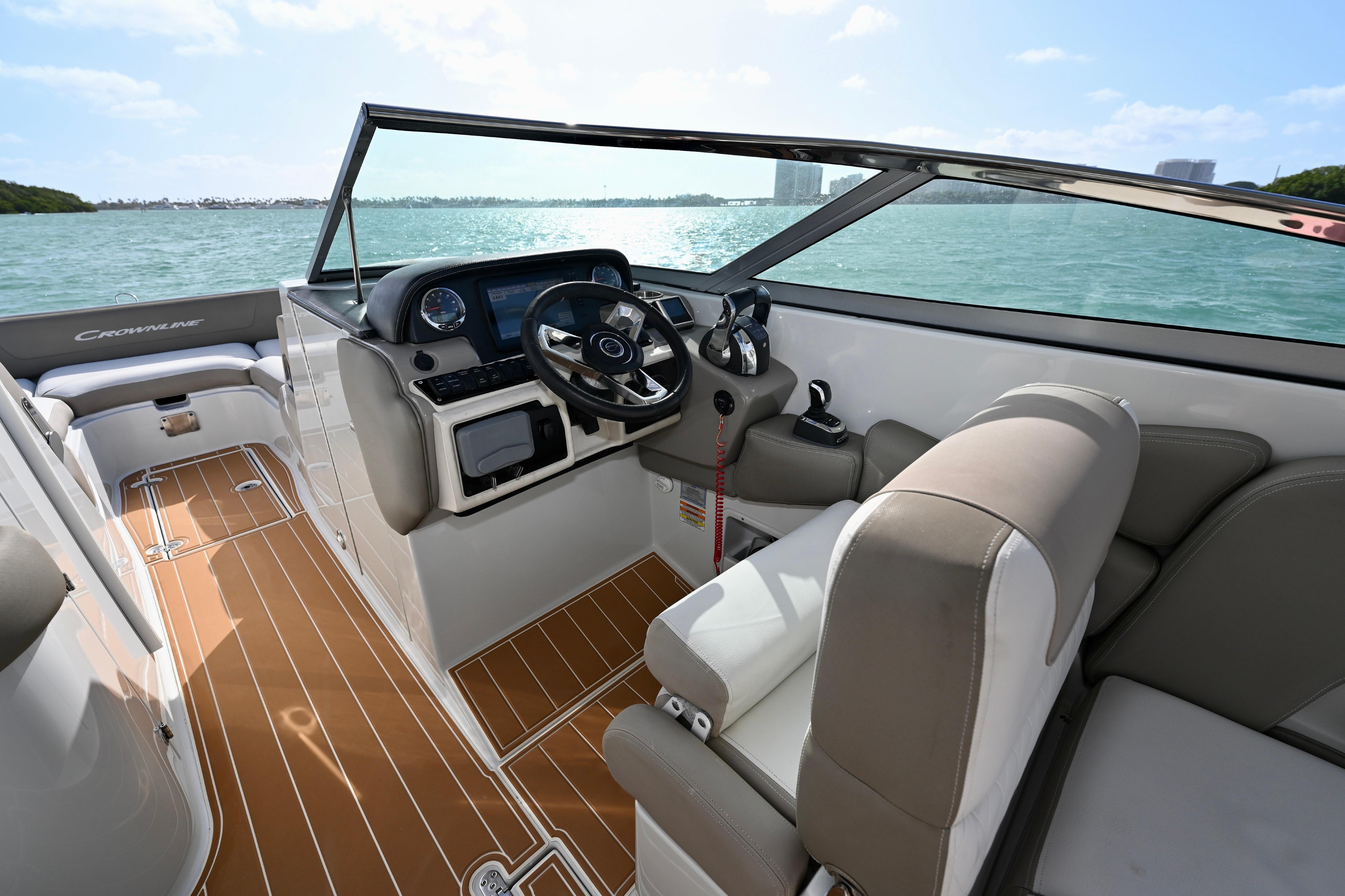 2020 Crownline Eclipse E305 XS boat interior with steering wheel and seating.