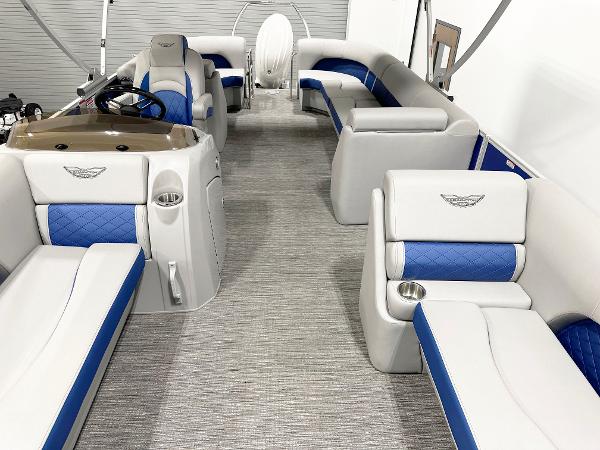 2025 Bennington 23LFBCSR pontoon boat interior with blue and white seating.