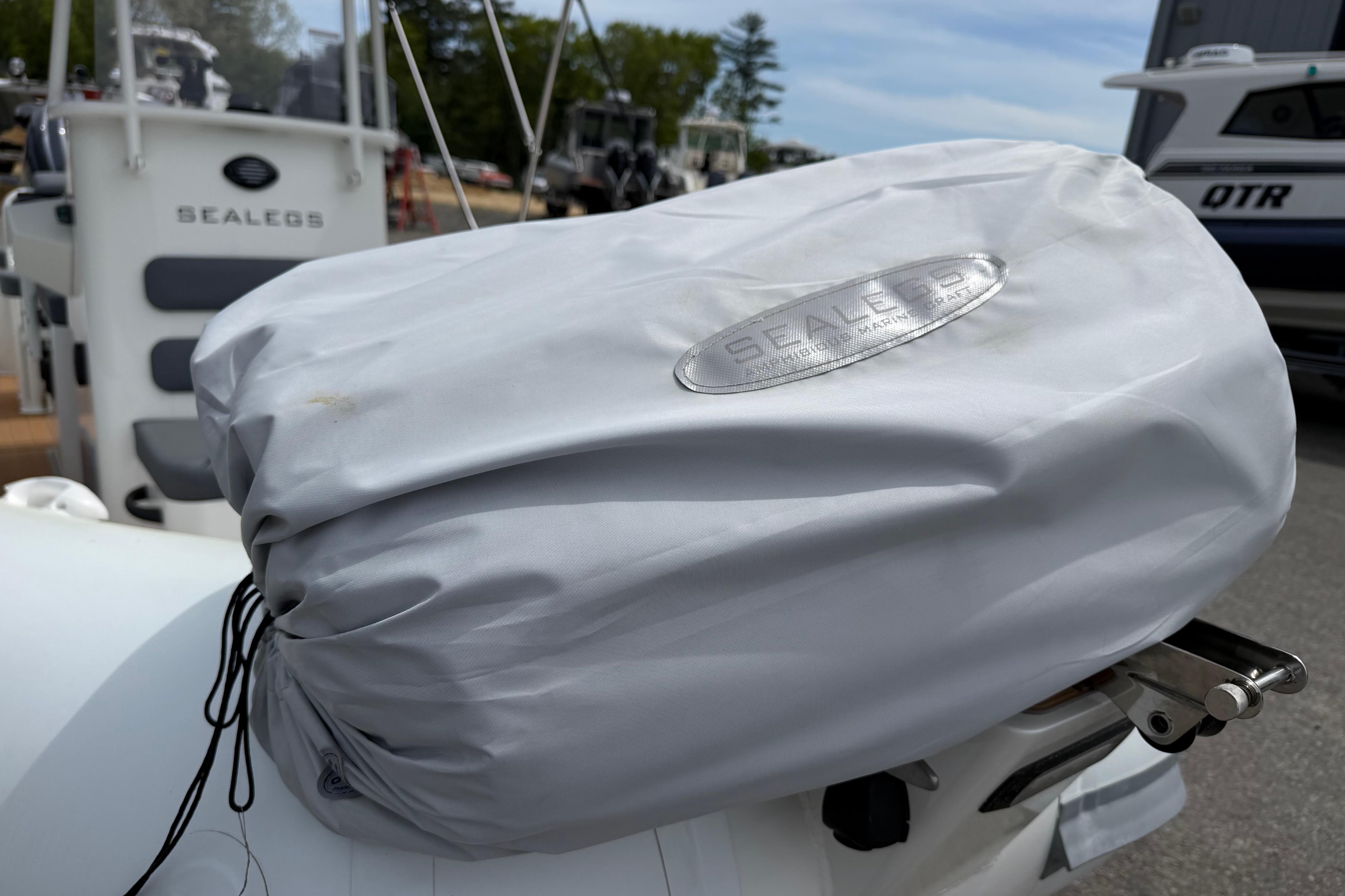 2024 Sealegs 7.1m RIB with protective cover, showcasing brand logo and design.