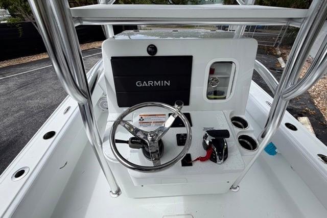 2025 Contender 26 Bay boat console with Garmin navigation system and steering wheel.