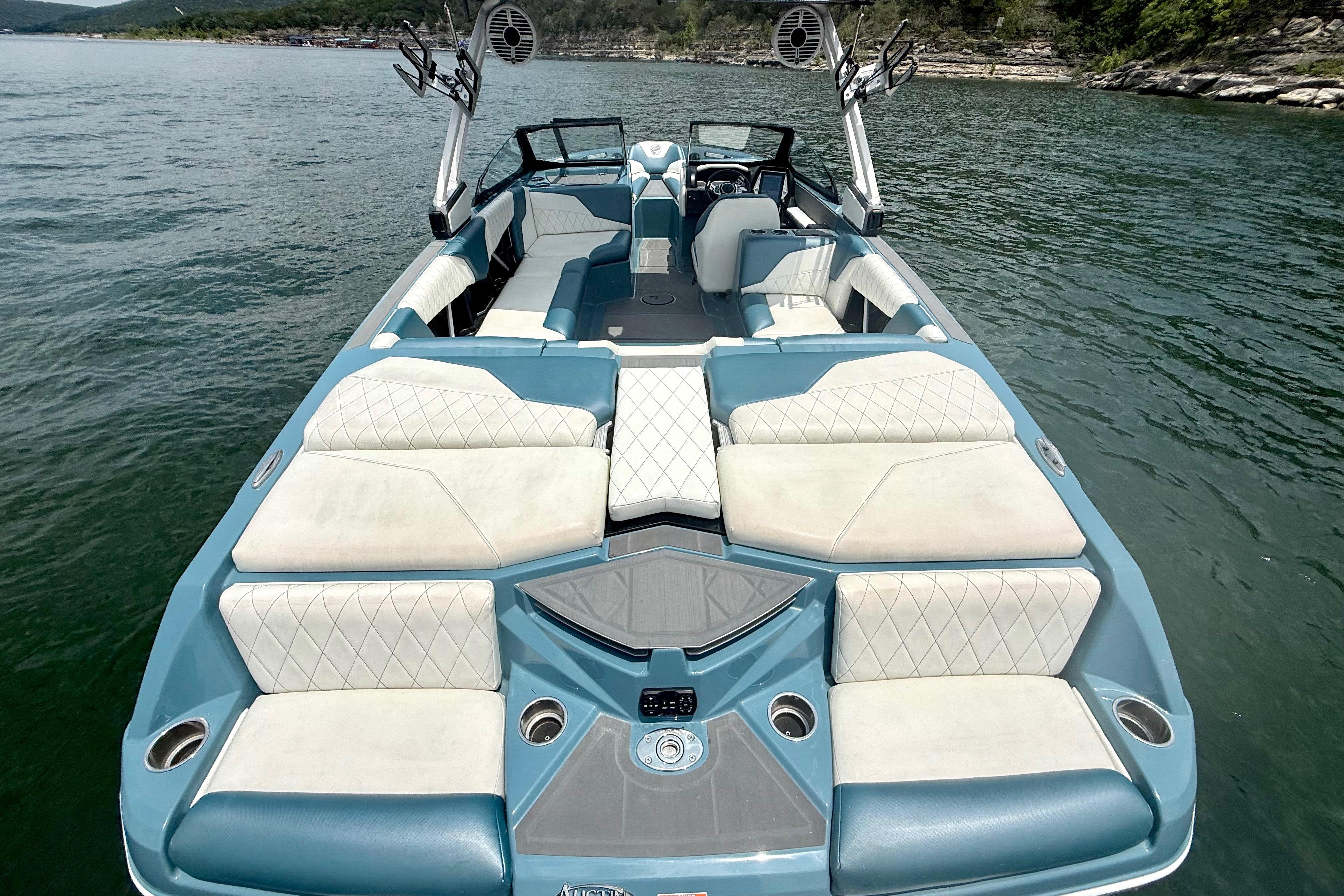 2021 Tige Z3 boat interior with blue and white seating on a lake.