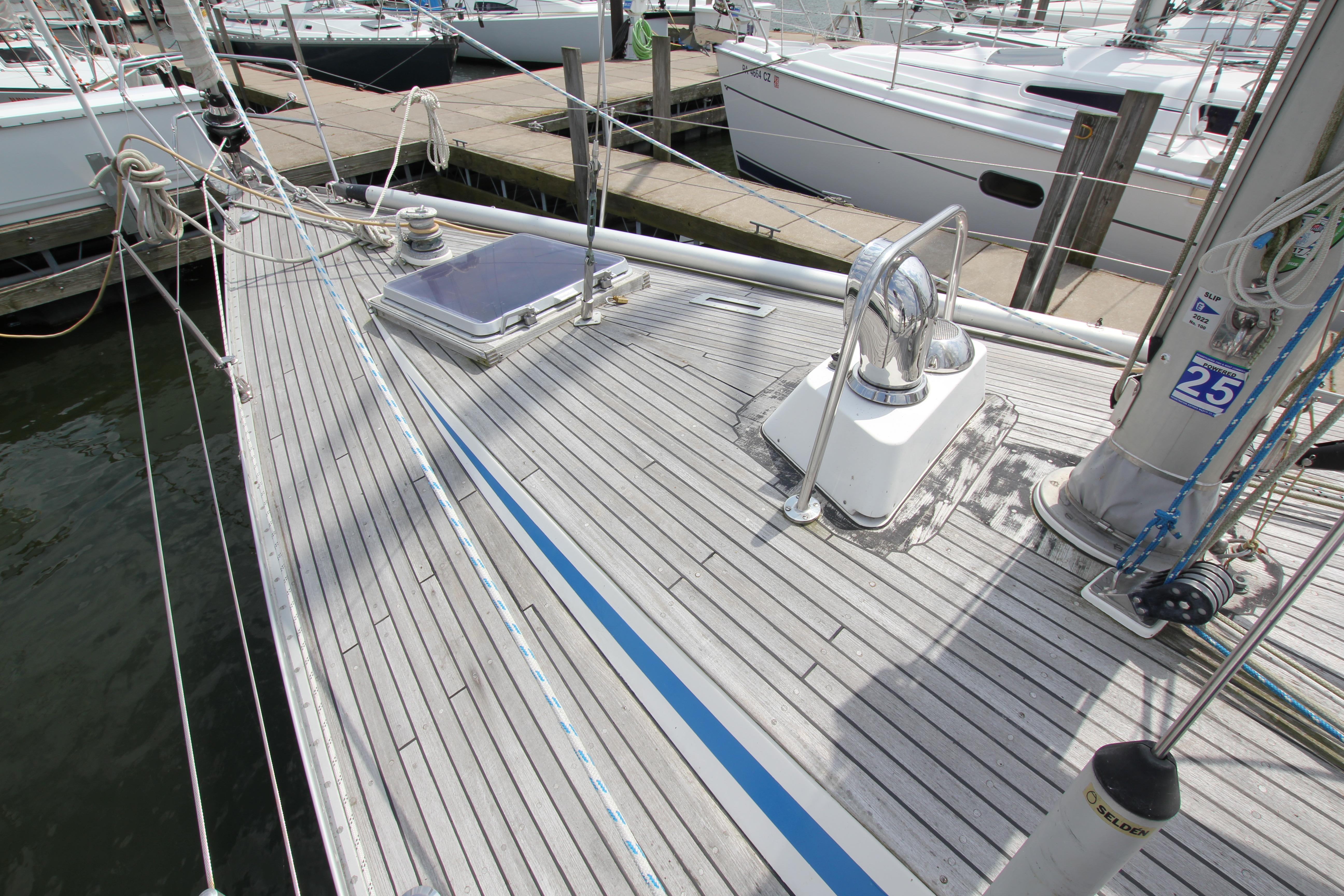 Deck of 1982 Nautor Swan 371 sailboat with winch and hatch.