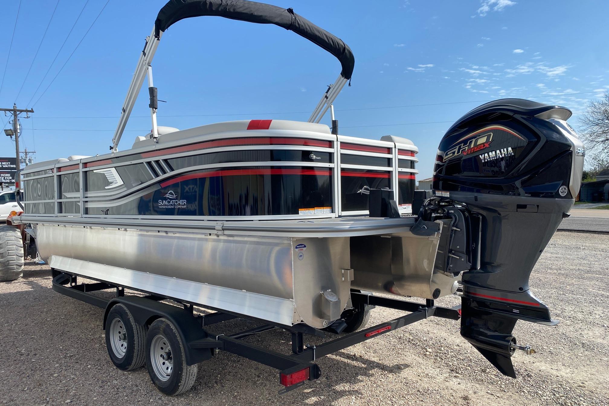 SunCatcher Select 322RC 2026 pontoon boat with Yamaha engine on trailer.