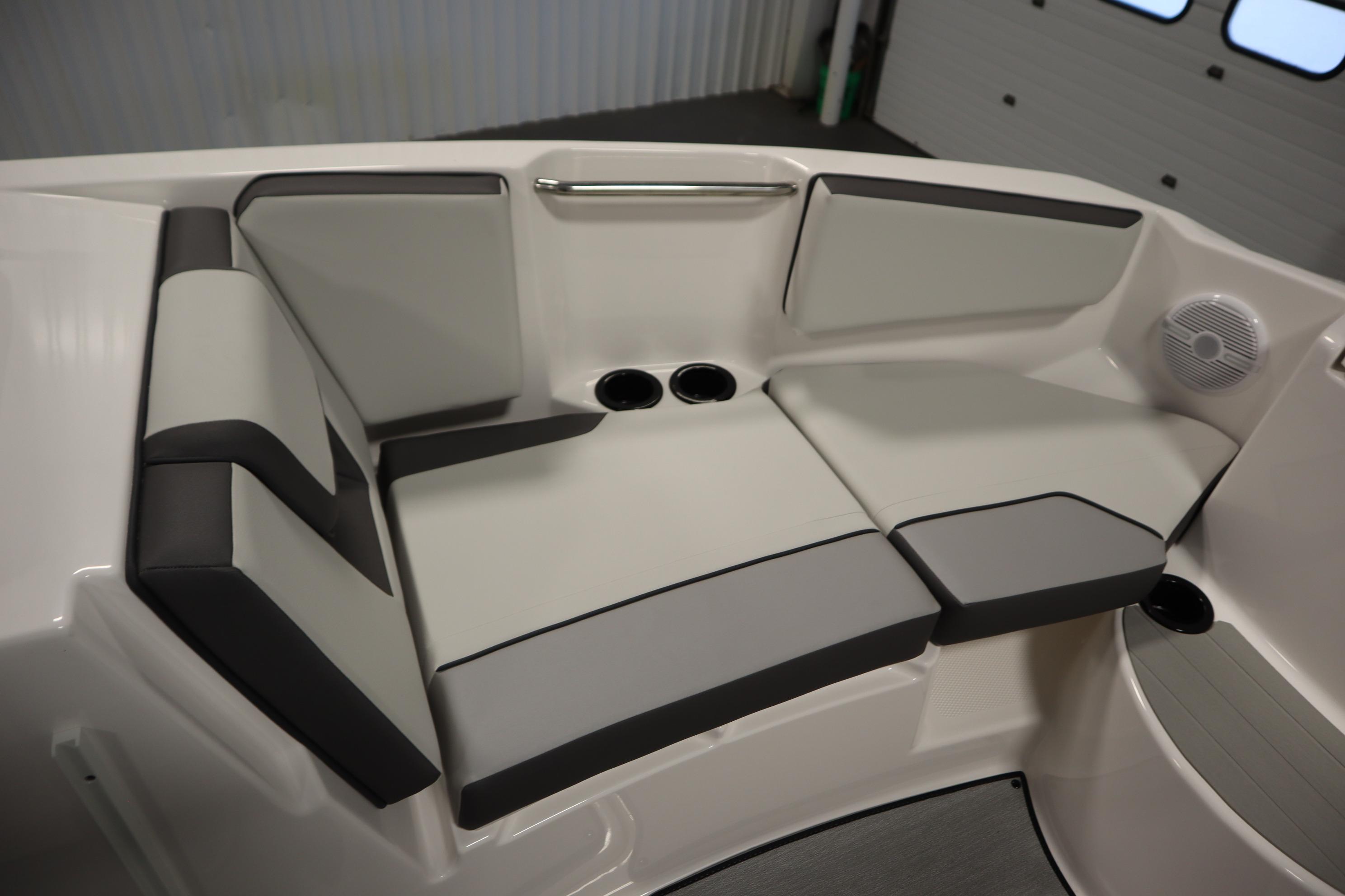 2026 Yamaha Boats AR220 interior seating with cup holders and speaker.