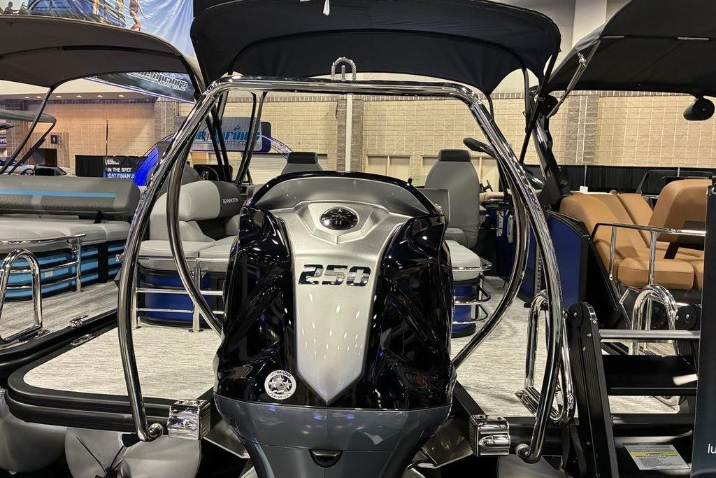 2026 Bennington 23 S Swingback pontoon boat with powerful 250 engine, showcased indoors.