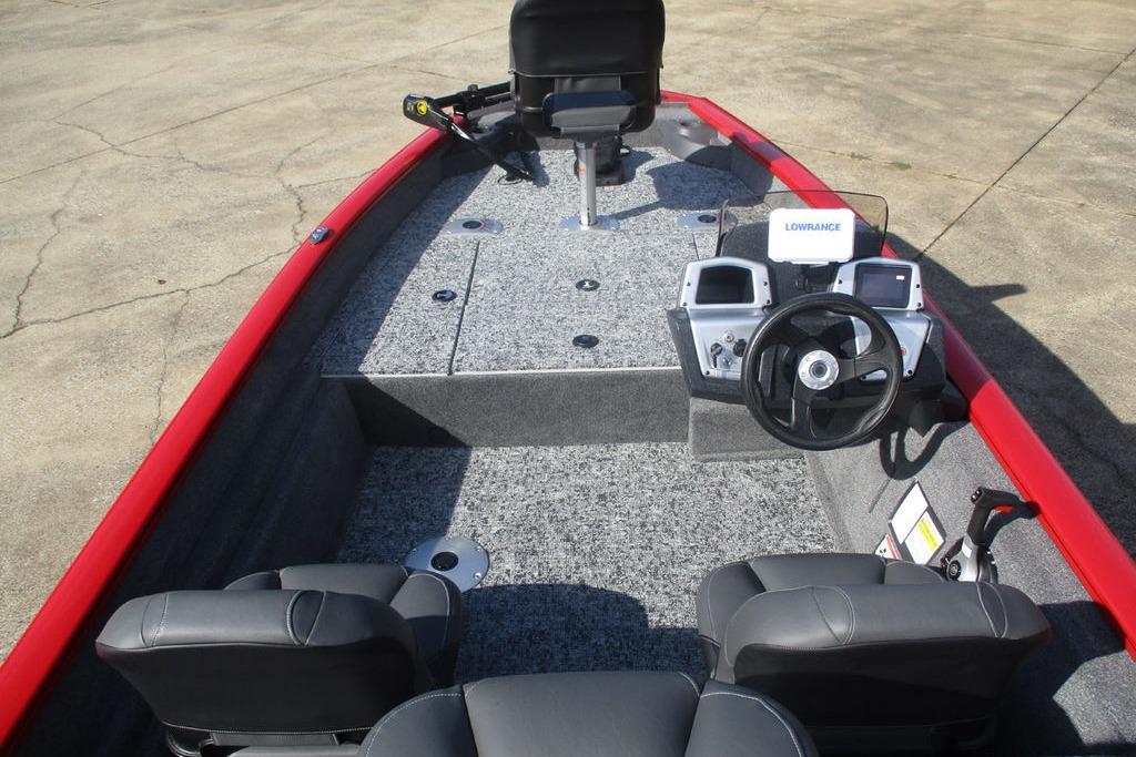 2026 Tracker Pro Team 175 boat interior with steering console and seating.