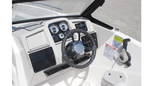 2025 Starcraft SVX 210 OB DC boat dashboard with steering wheel and control panel.