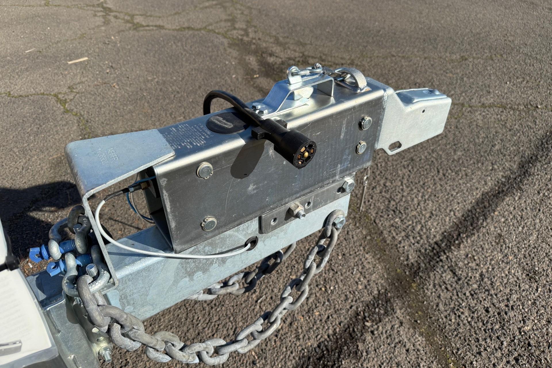 Trailer hitch of 2025 Thunder Jet 24 Alexis Pro on asphalt surface.