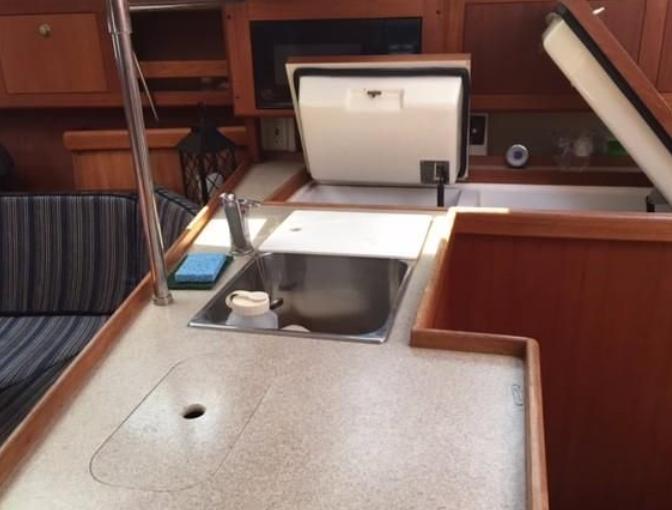 Interior of 2001 Hunter 380 yacht showing kitchen sink and countertop area.