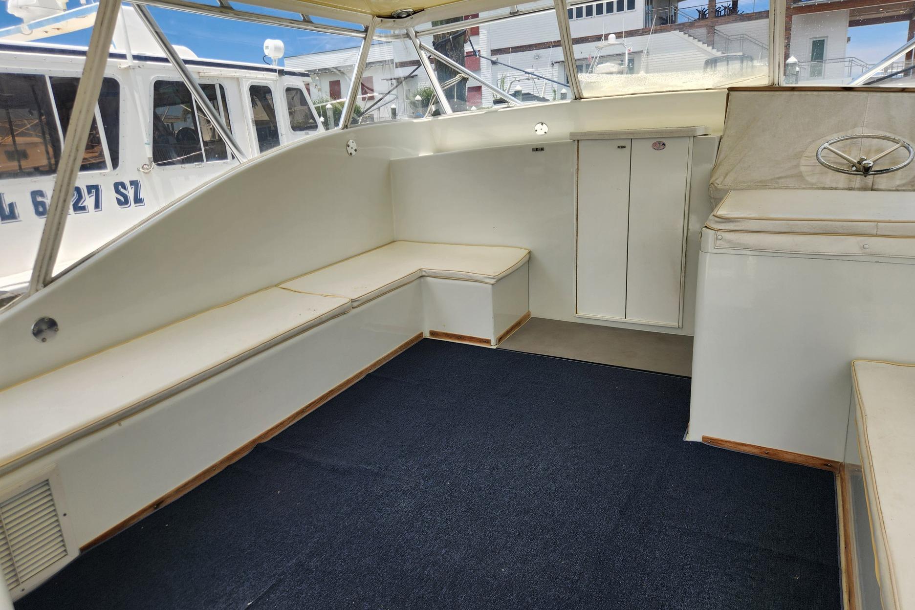 Interior of 1987 Young Brothers Custom Sport Fish boat with seating and storage.