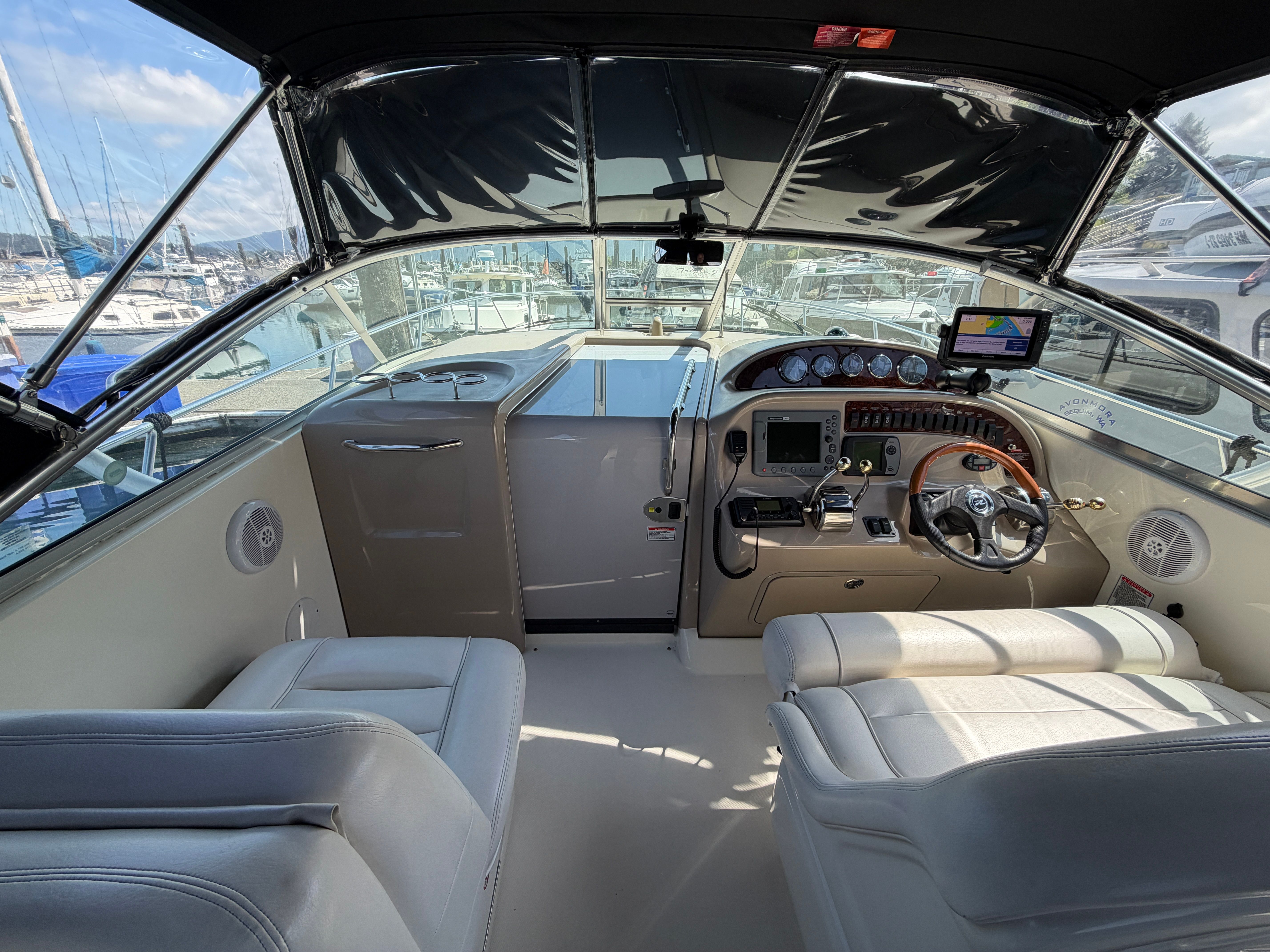 Interior of a 2005 Sea Ray 290 Amberjack yacht with helm console.