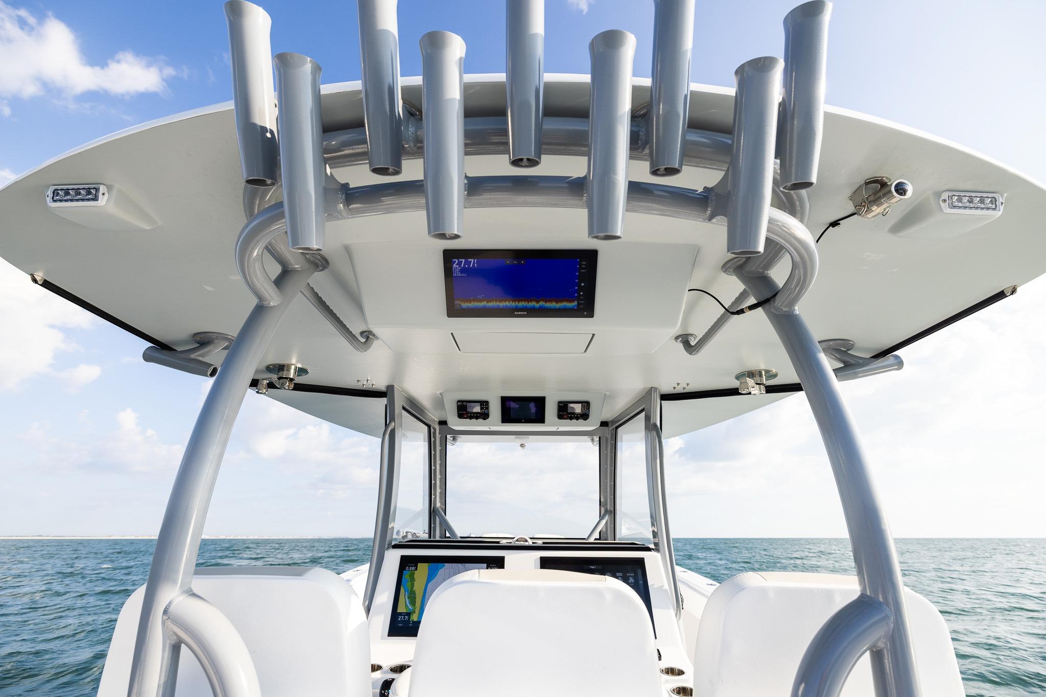 2026 Front Runner 37 Catamaran helm with advanced navigation systems on open water.