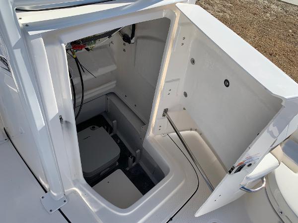 2024 Robalo 226 Cayman boat interior storage compartment with open hatch.