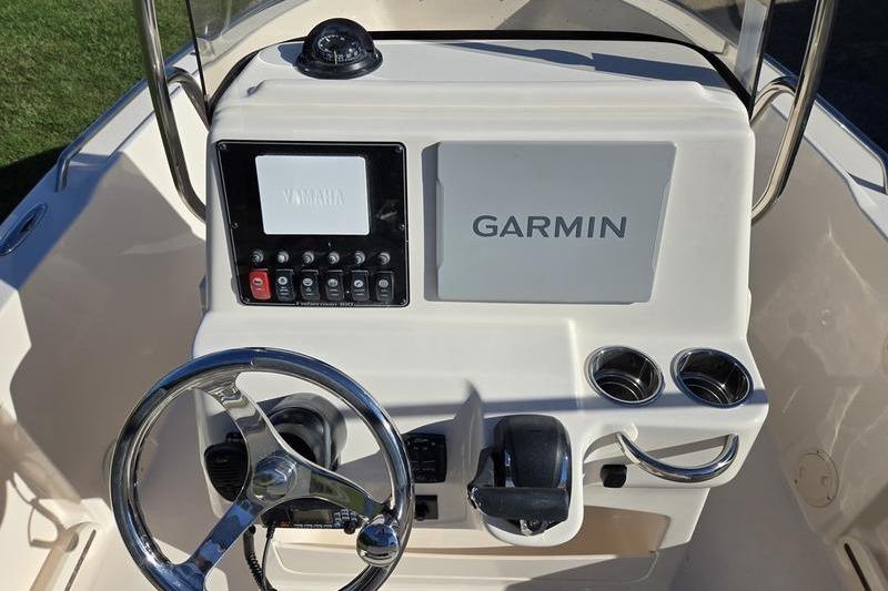 2026 Grady-White Fisherman 180 boat console with Garmin navigation system and steering wheel.