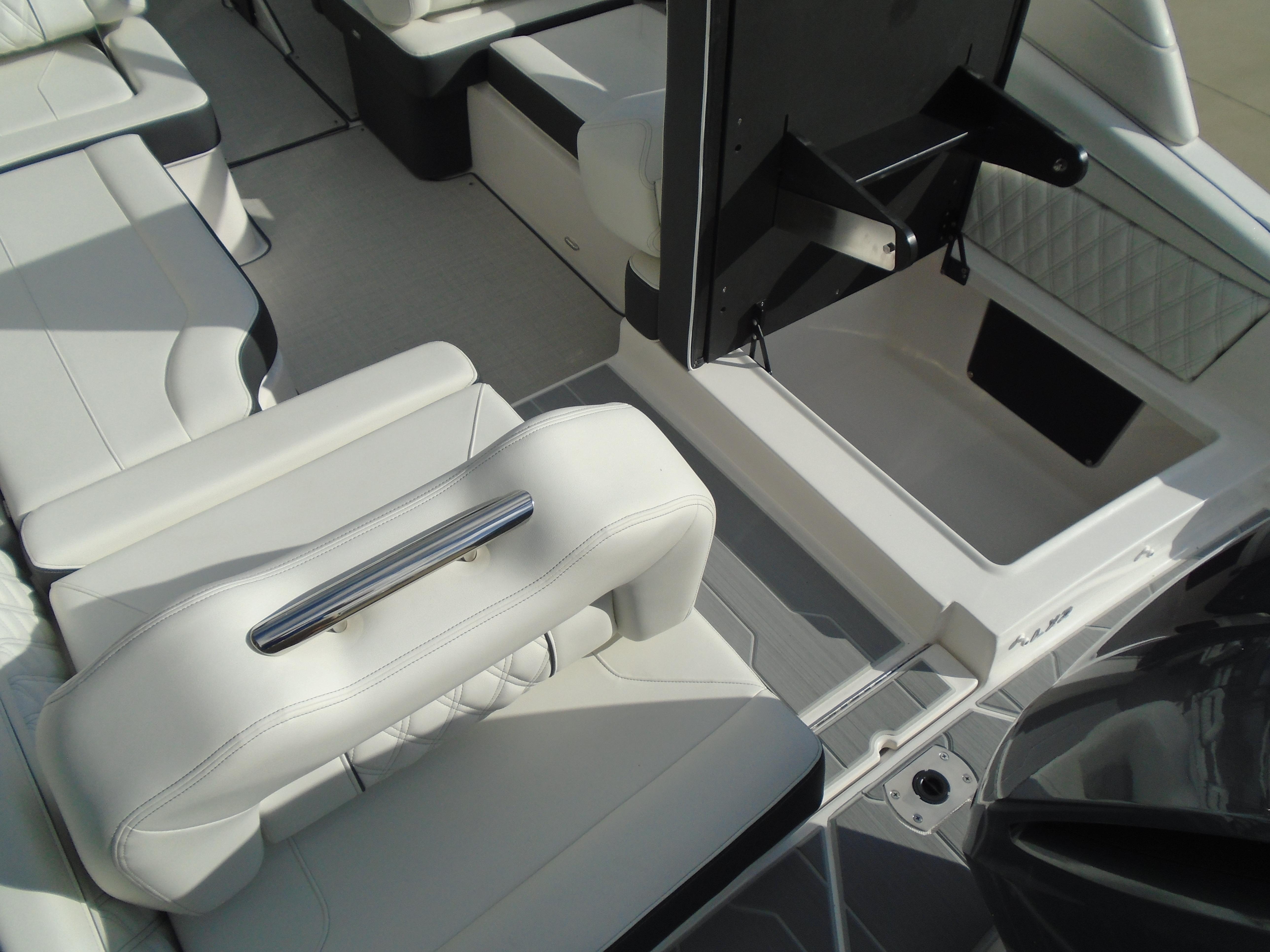 Luxurious interior of 2025 Regal LX2 boat with white seating and modern design.