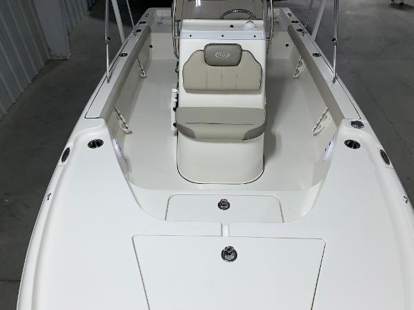2026 Key West 188 Bay Reef boat interior with seating and console, in a storage area.
