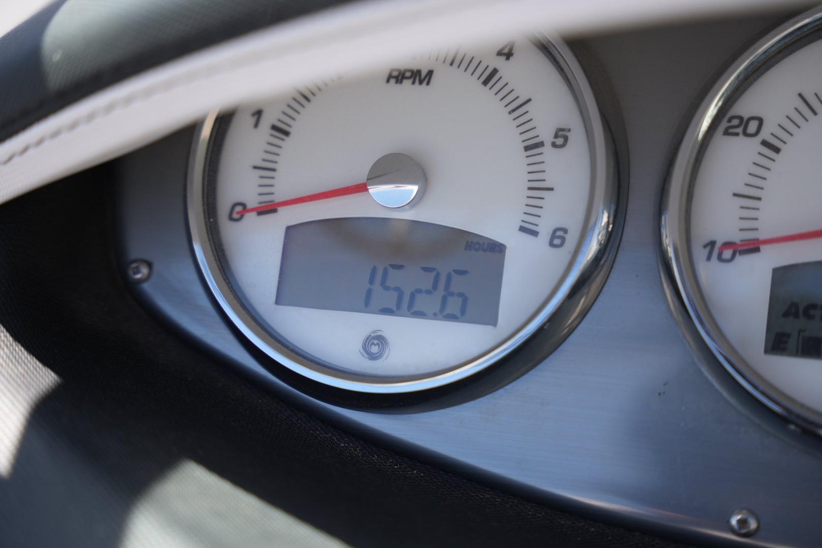 Close-up of 2016 Supreme S211 dashboard gauges displaying 152.6 hours.