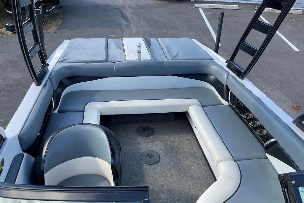 2015 Moomba Outback V boat interior with gray seating and cup holders.