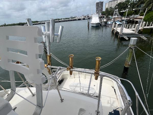1985 Hatteras 45 Convertible yacht docked in a marina, view from the deck.