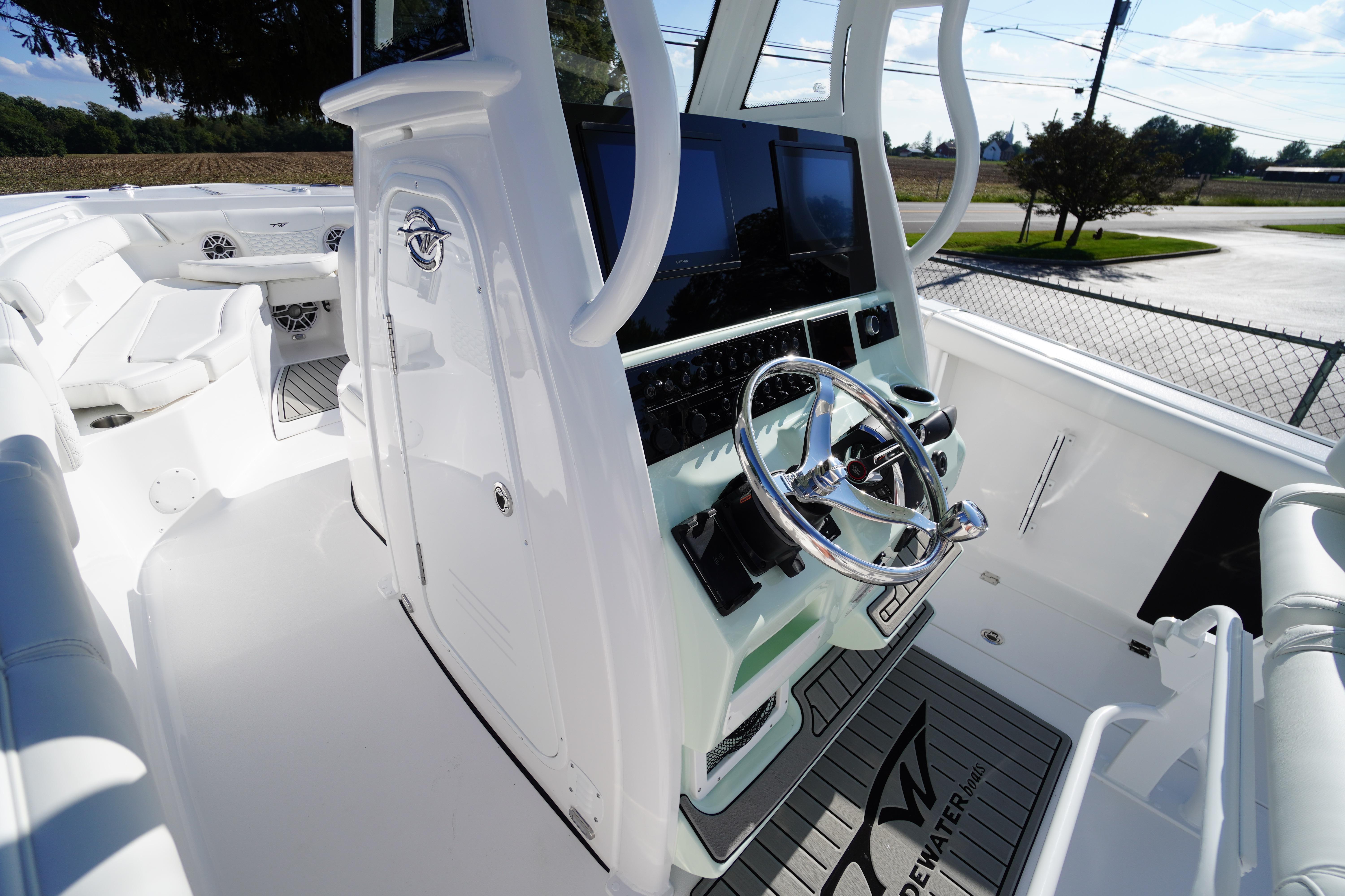 2026 Tidewater 272 LXF boat cockpit with modern steering and navigation controls.