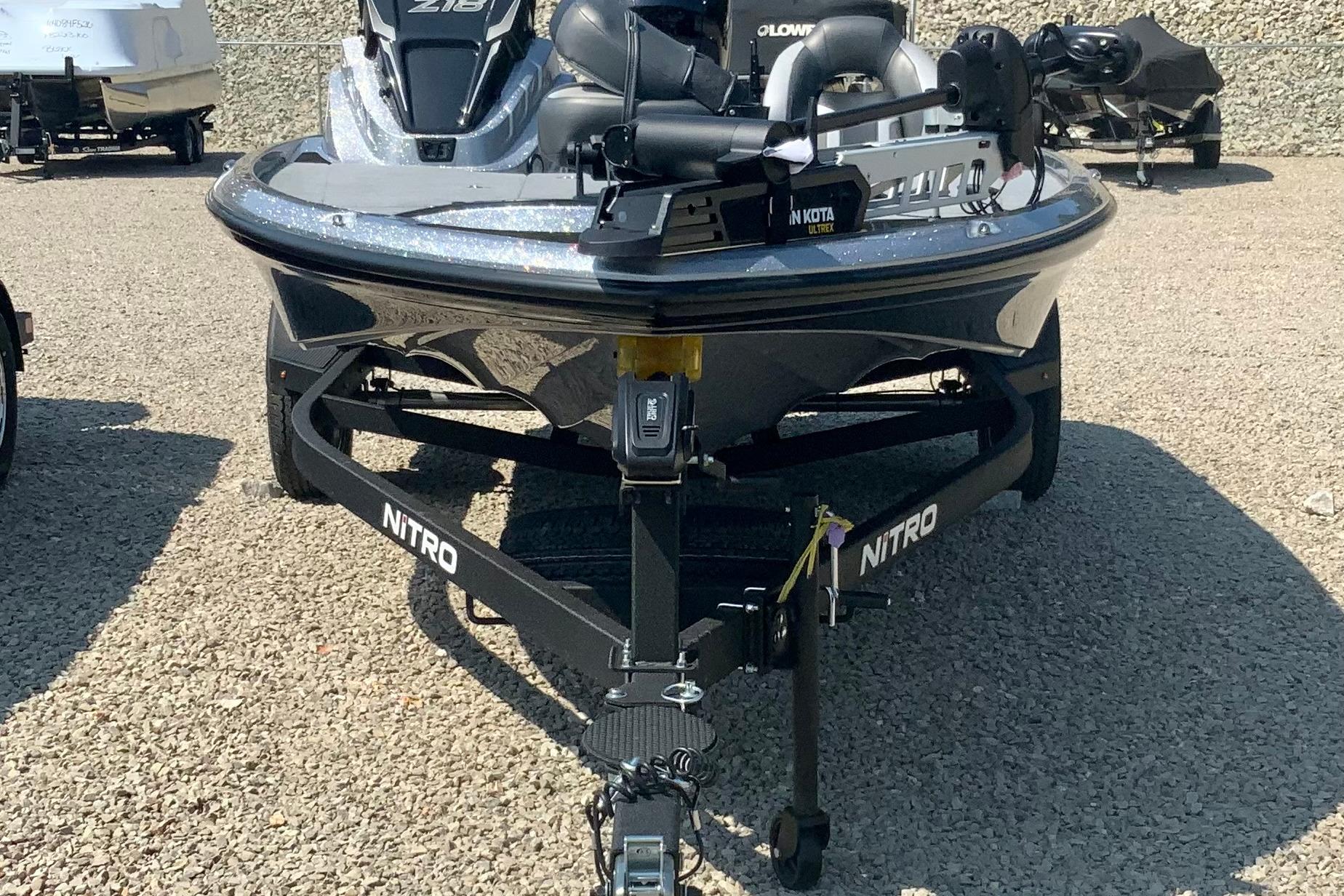 2026 Nitro Z18 Pro boat on trailer, parked on gravel surface.