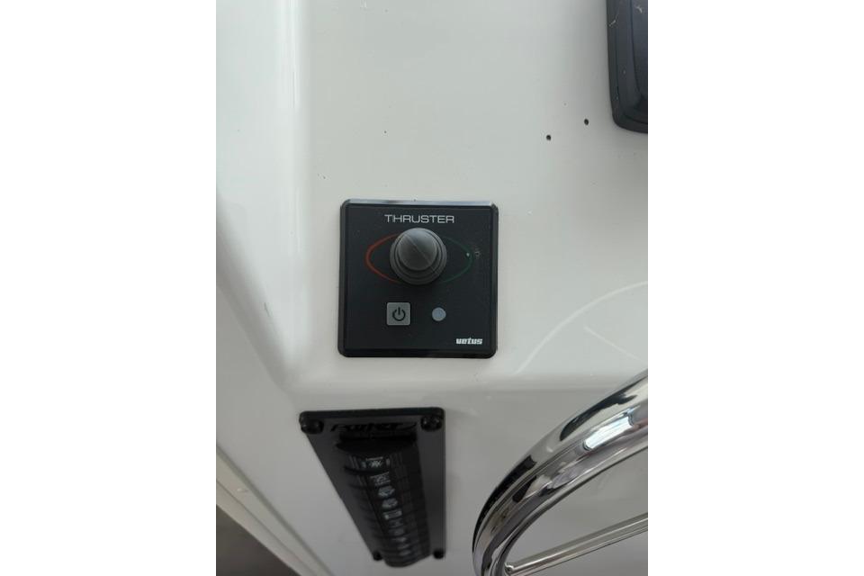 Control panel of a 2016 Parker 2520 Sport Cabin boat, featuring a thruster joystick.