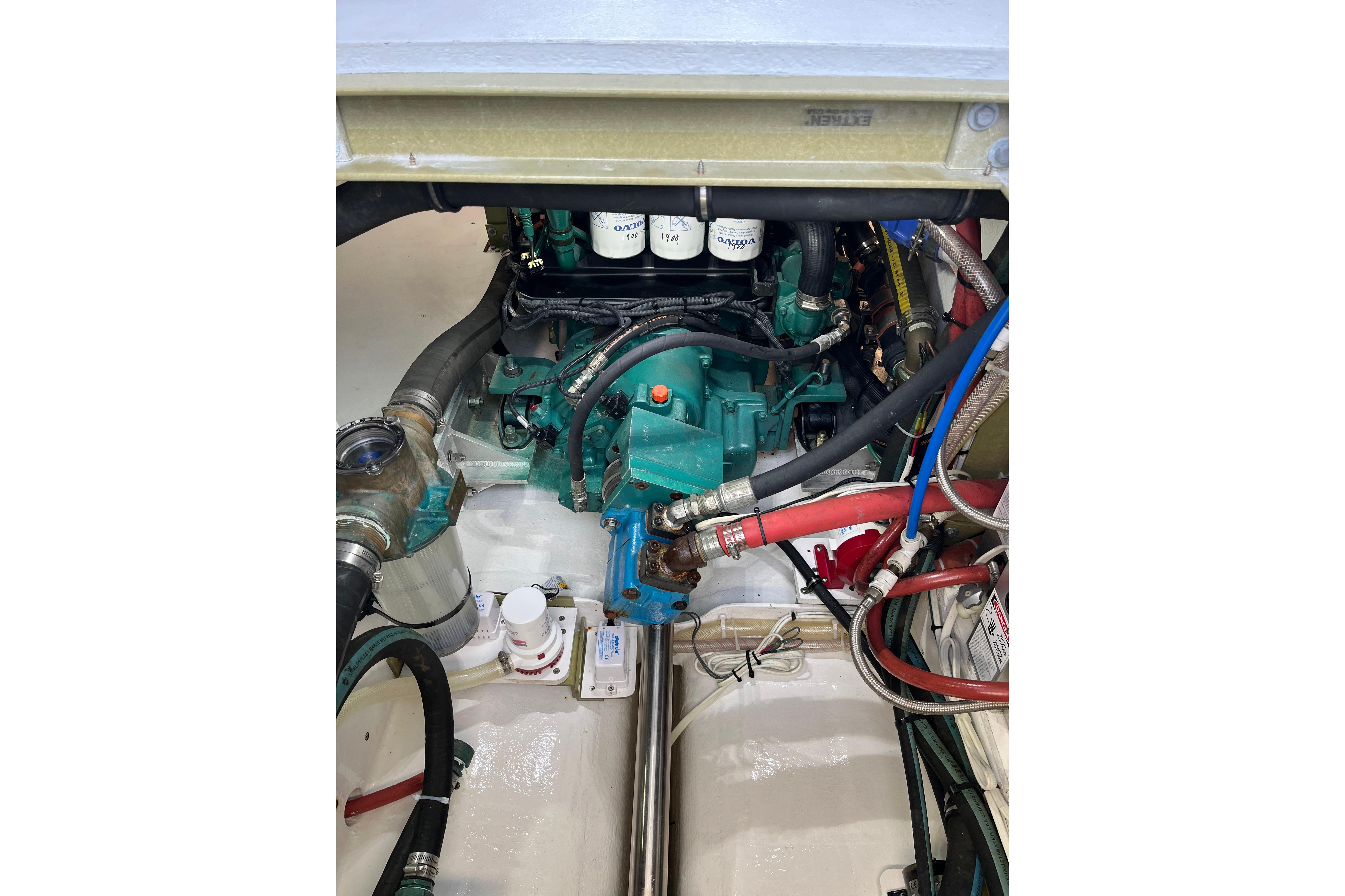 Engine compartment of a 2018 H&H Marine Osmond Beal boat, showcasing mechanical components.
