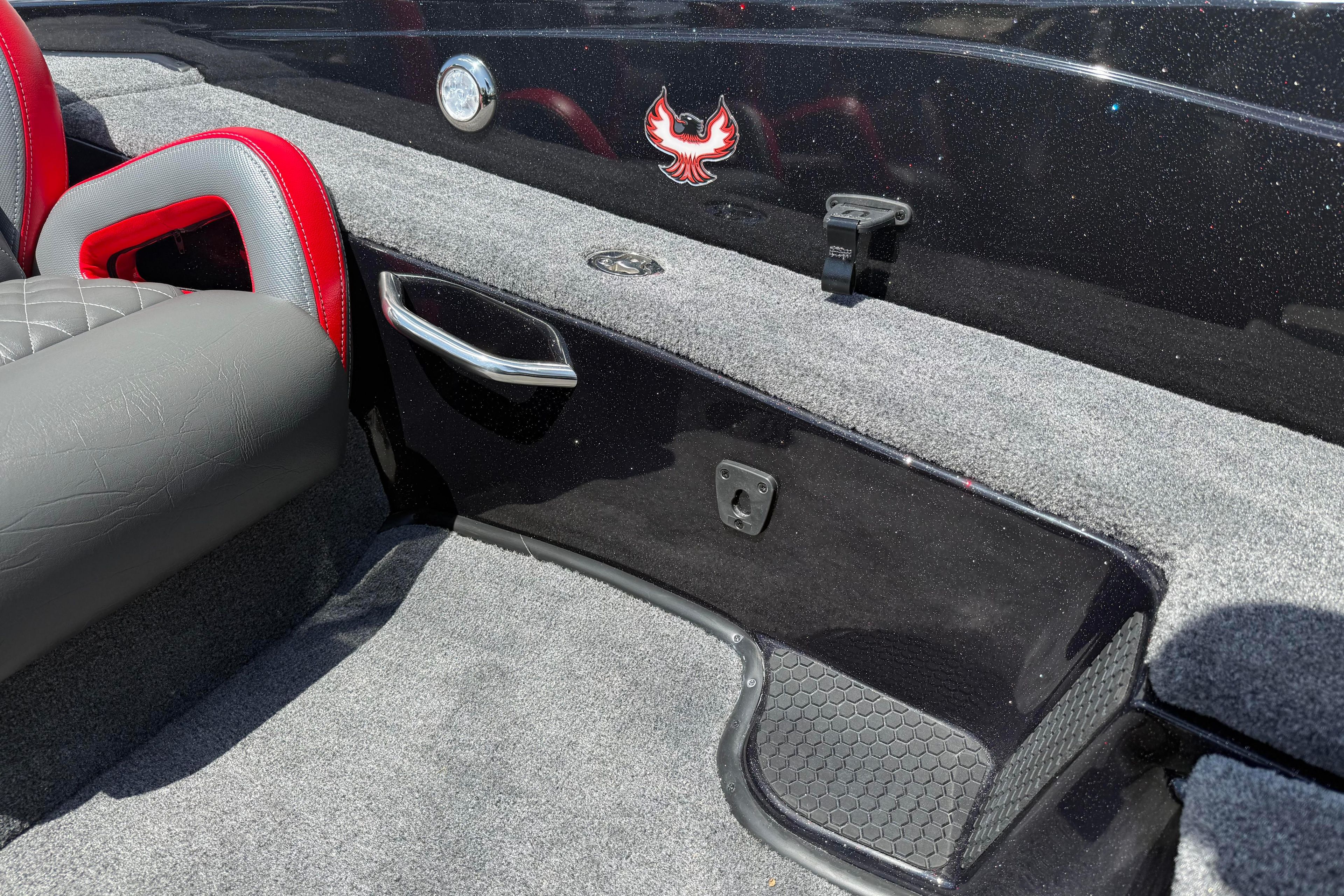 Interior of 2027 Phoenix 919 ZXL boat with red and gray seating.