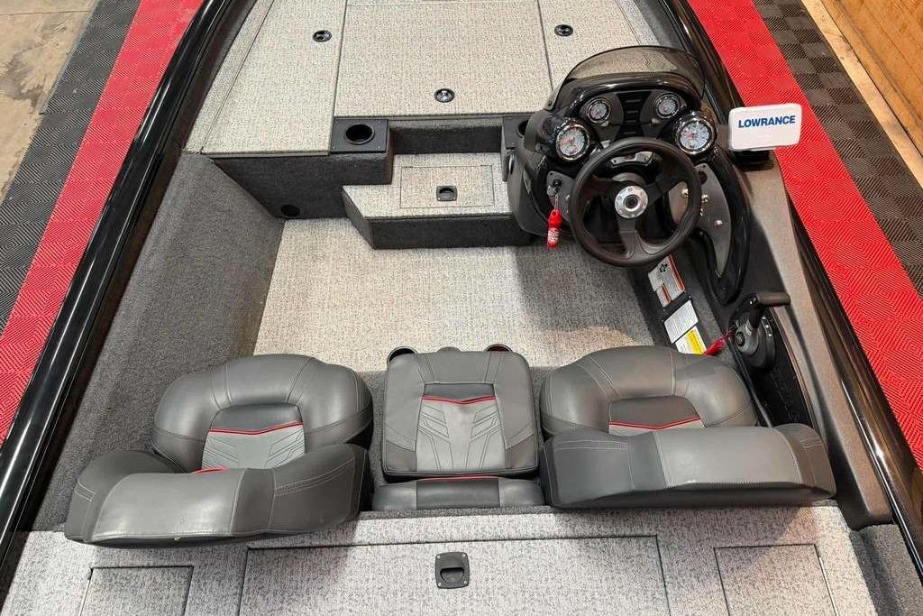 2024 Tracker Pro Team 175 boat interior with steering console and seating.