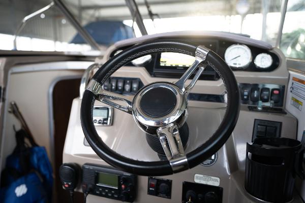 Steering wheel and dashboard of 2016 Regal 28 Express boat.