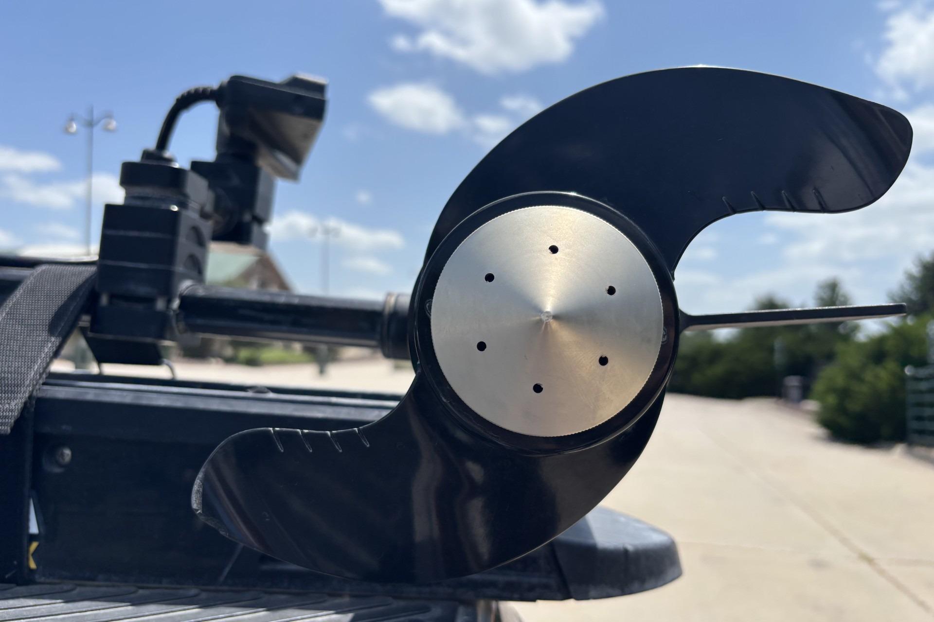 Close-up of a 2011 Ranger 620 VS boat propeller under a clear blue sky.