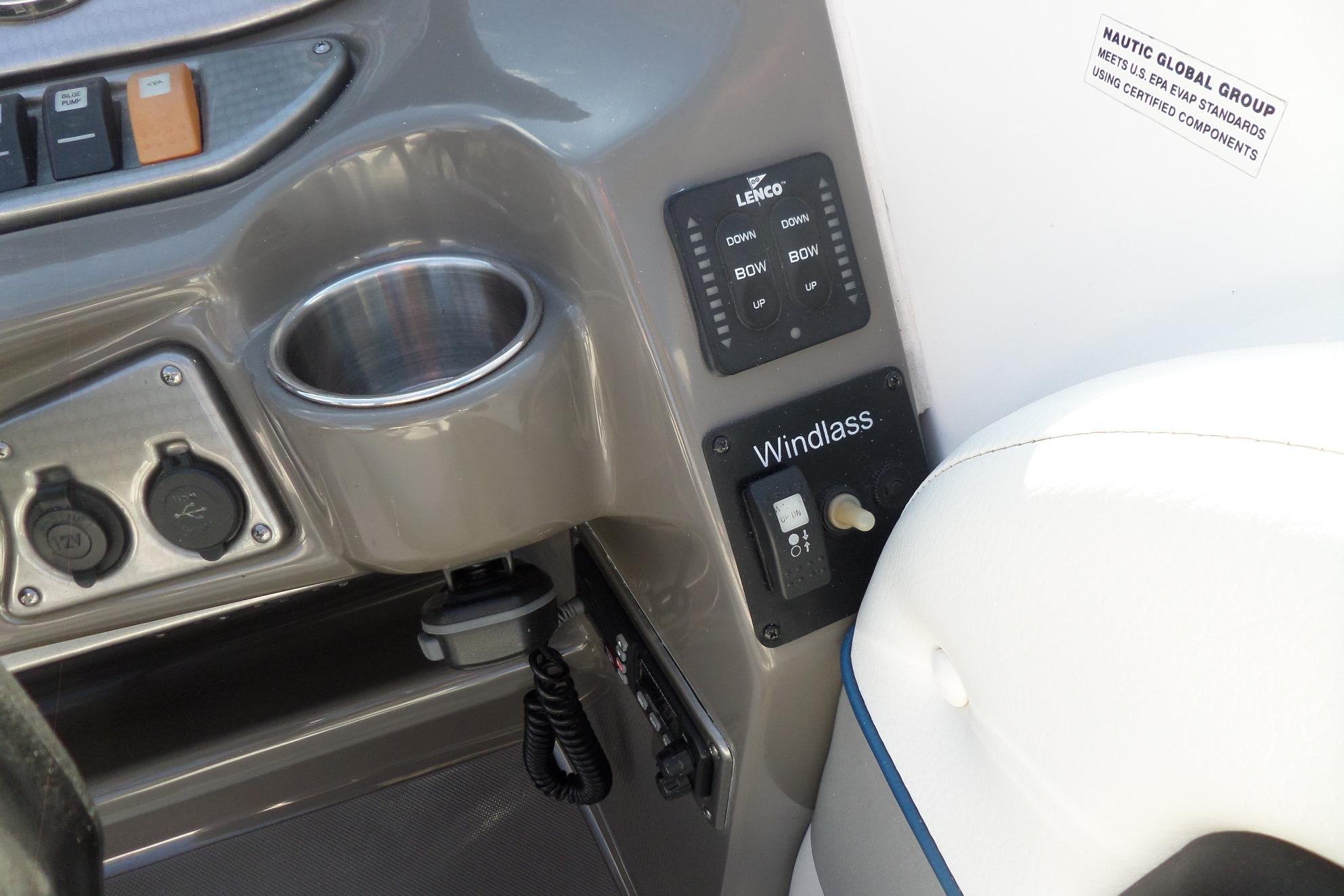 Control panel of 2013 Rinker 296 Captiva Cuddy boat with windlass switch and cup holder.