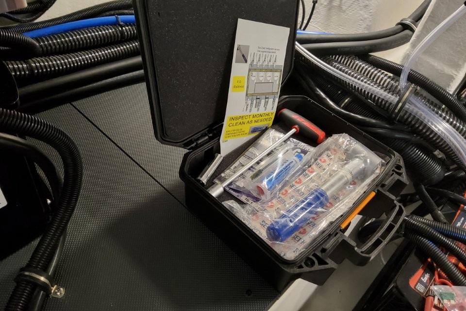 Tool kit on Formula 380 Super Sport Crossover OB, 2026 model, with maintenance instructions.