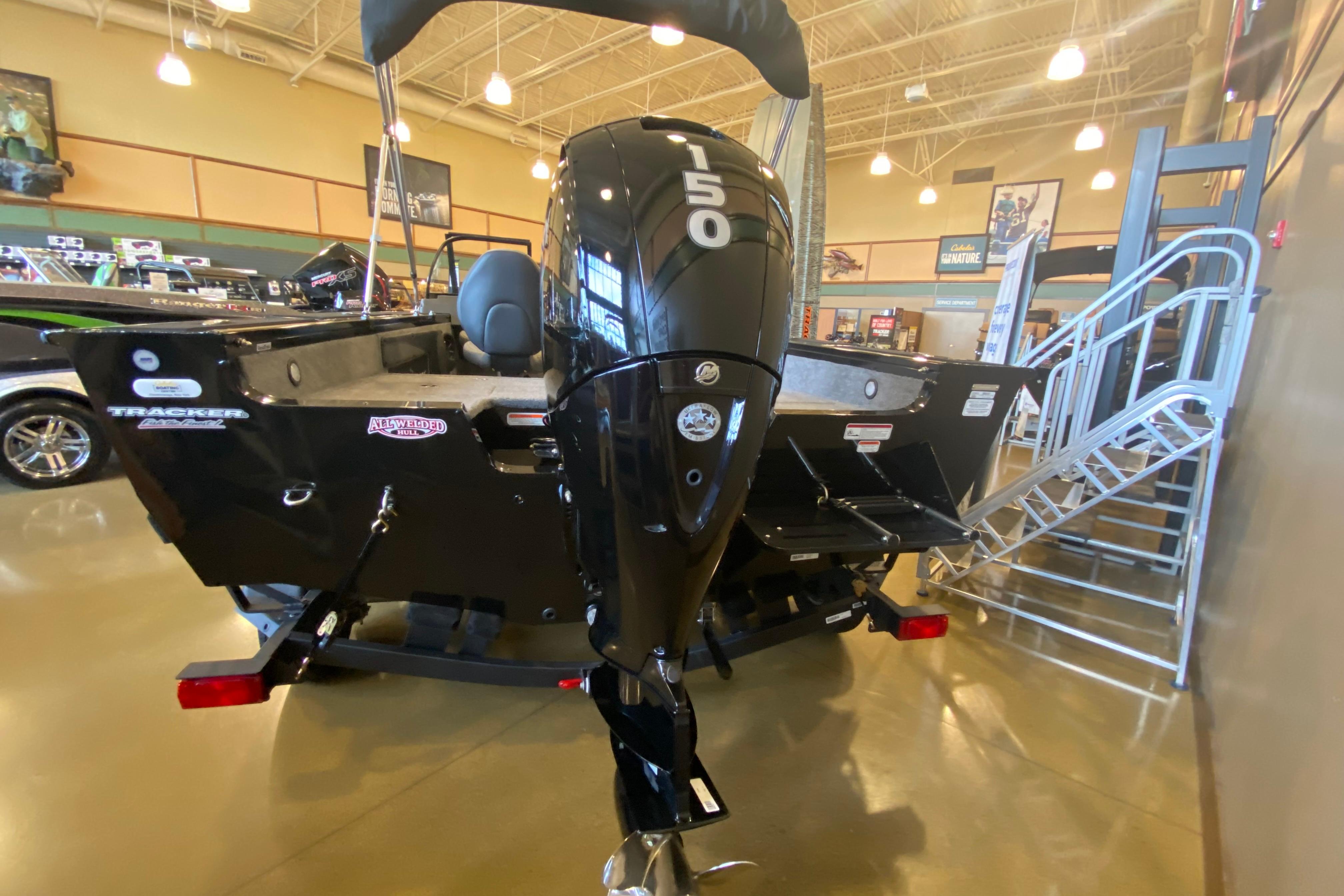 2026 Tracker Targa V-19 WT boat with 150 horsepower engine displayed indoors.