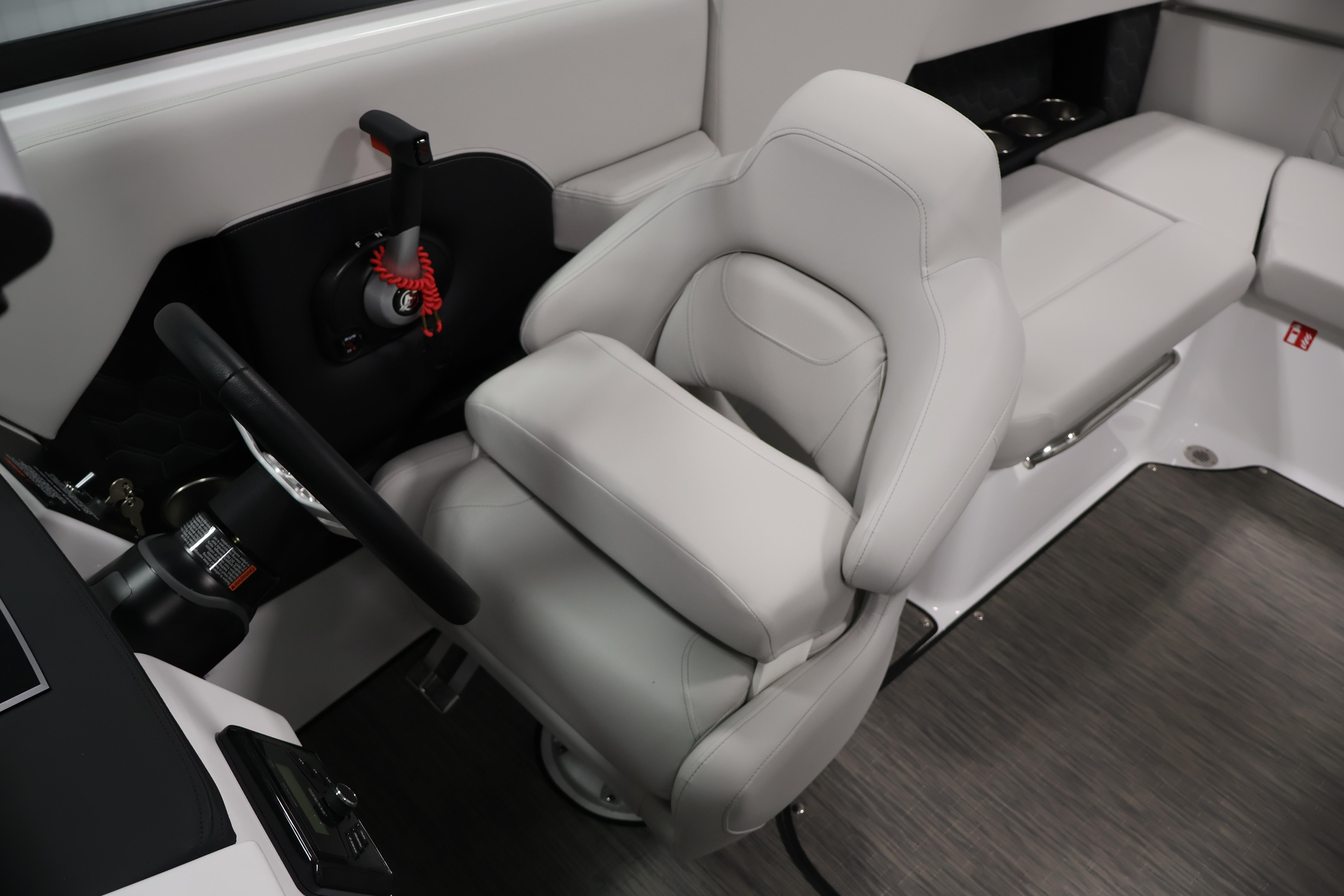 2026 Four Winns H4 Freedom boat interior with sleek steering and comfortable seating.