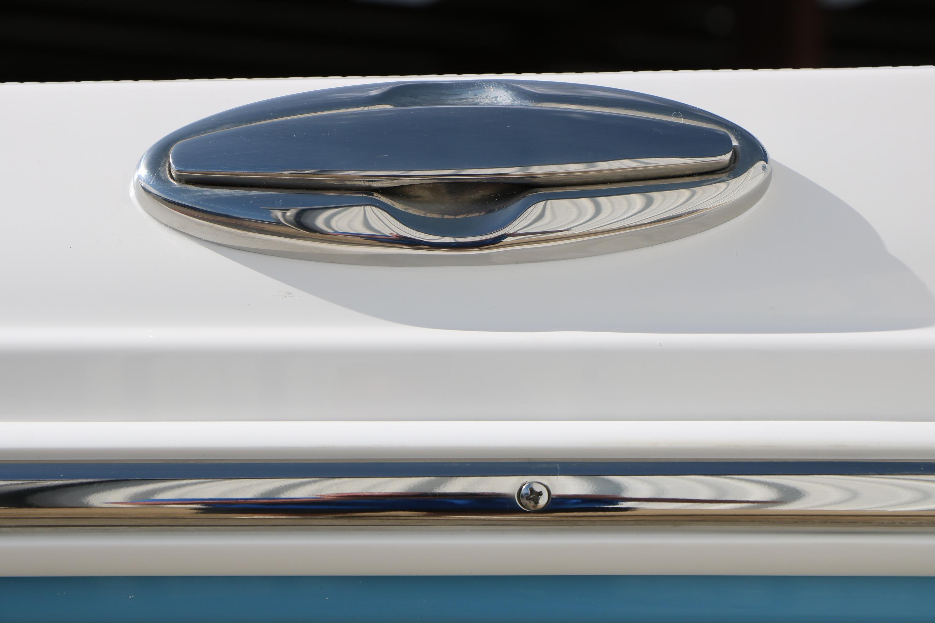 Close-up of a 2026 Robalo R200 Center Console boat's sleek chrome handle.