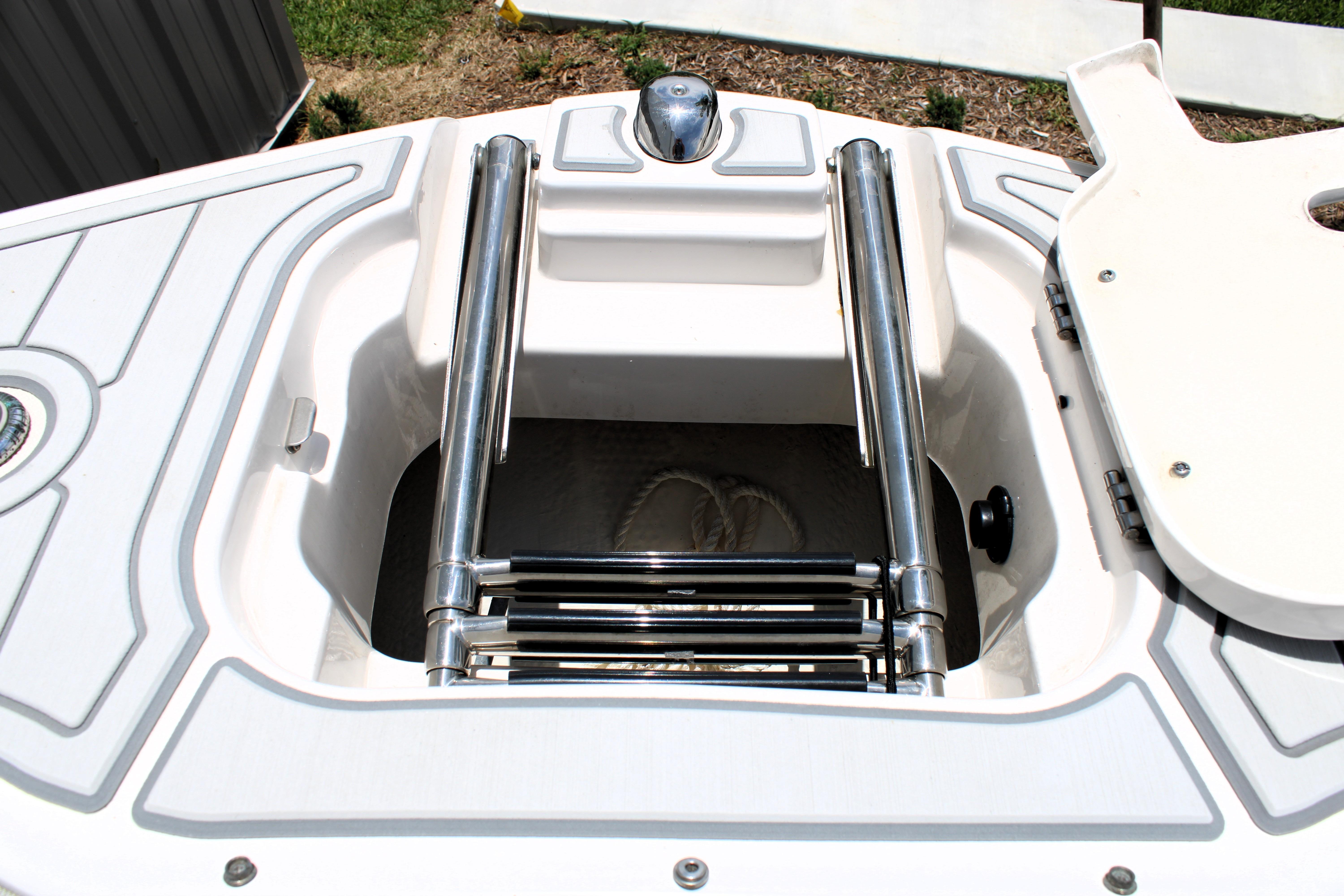 2021 Regal 26 OBX boat ladder and storage compartment detail.