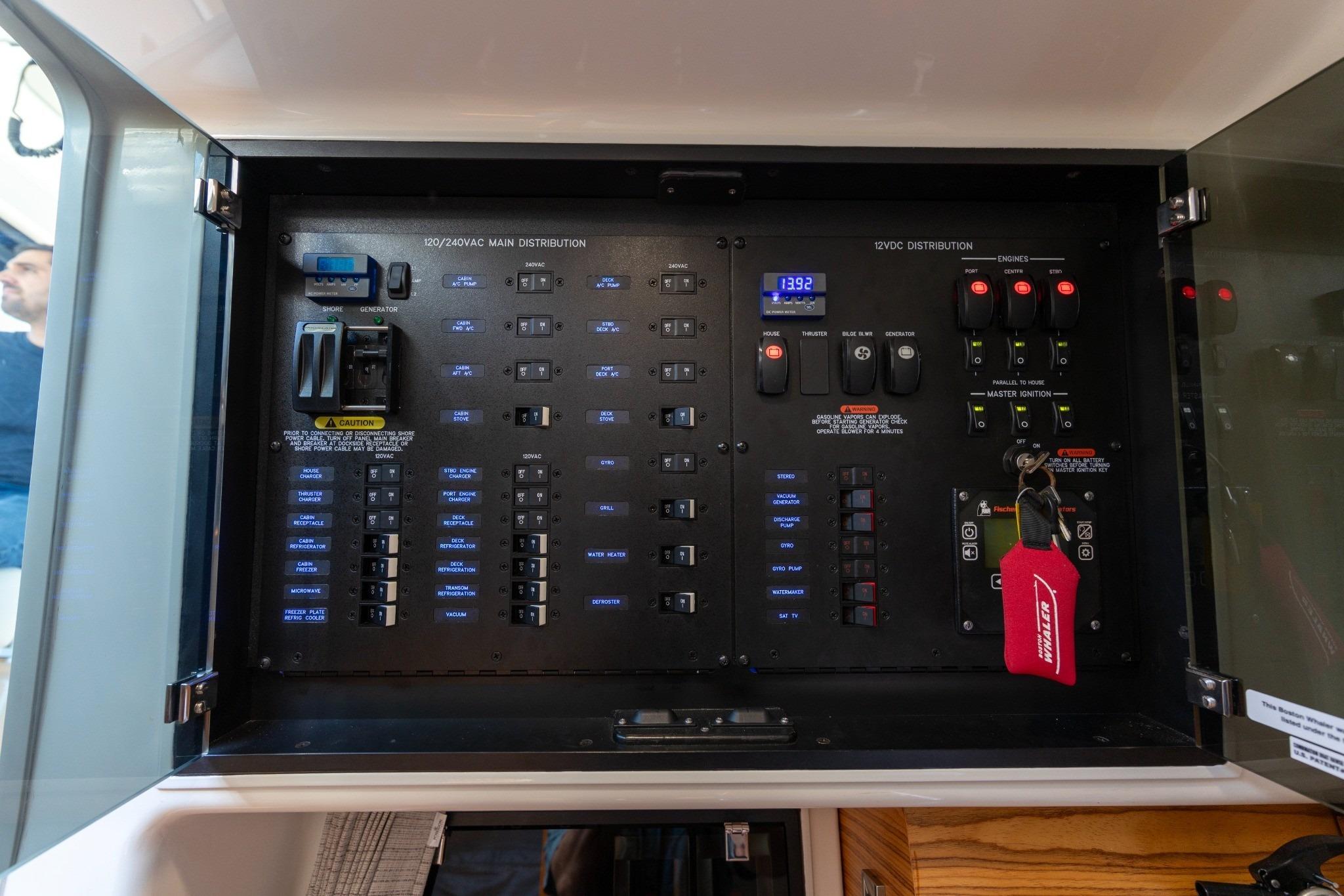 Electrical panel of 2023 Boston Whaler 405 Conquest boat, showcasing controls and distribution systems.
