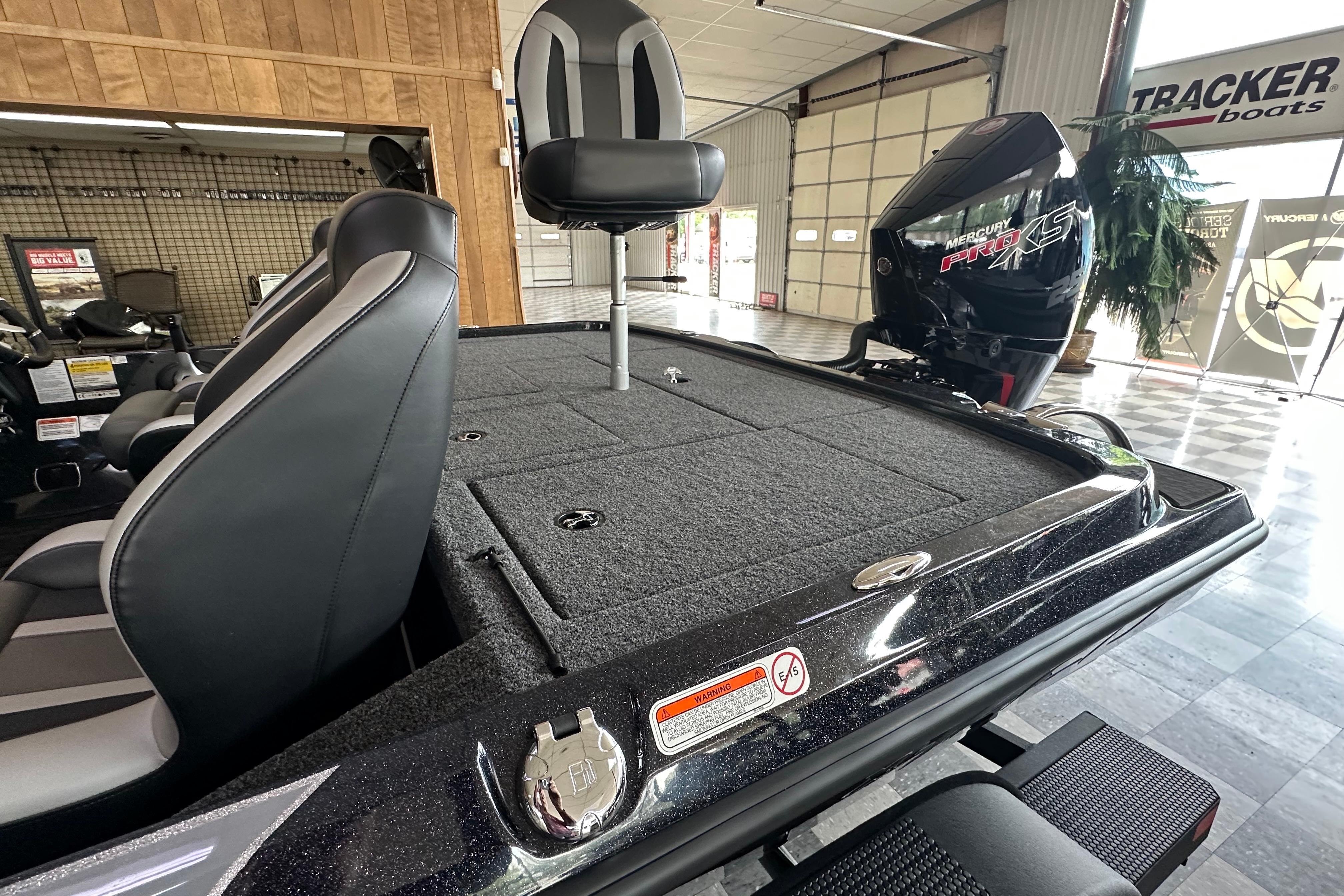 2025 Nitro Z20 XL Pro boat interior with Mercury Pro XS engine in showroom.