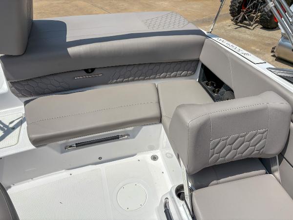 2023 Four Winns H1 boat interior with gray cushioned seating and textured design.