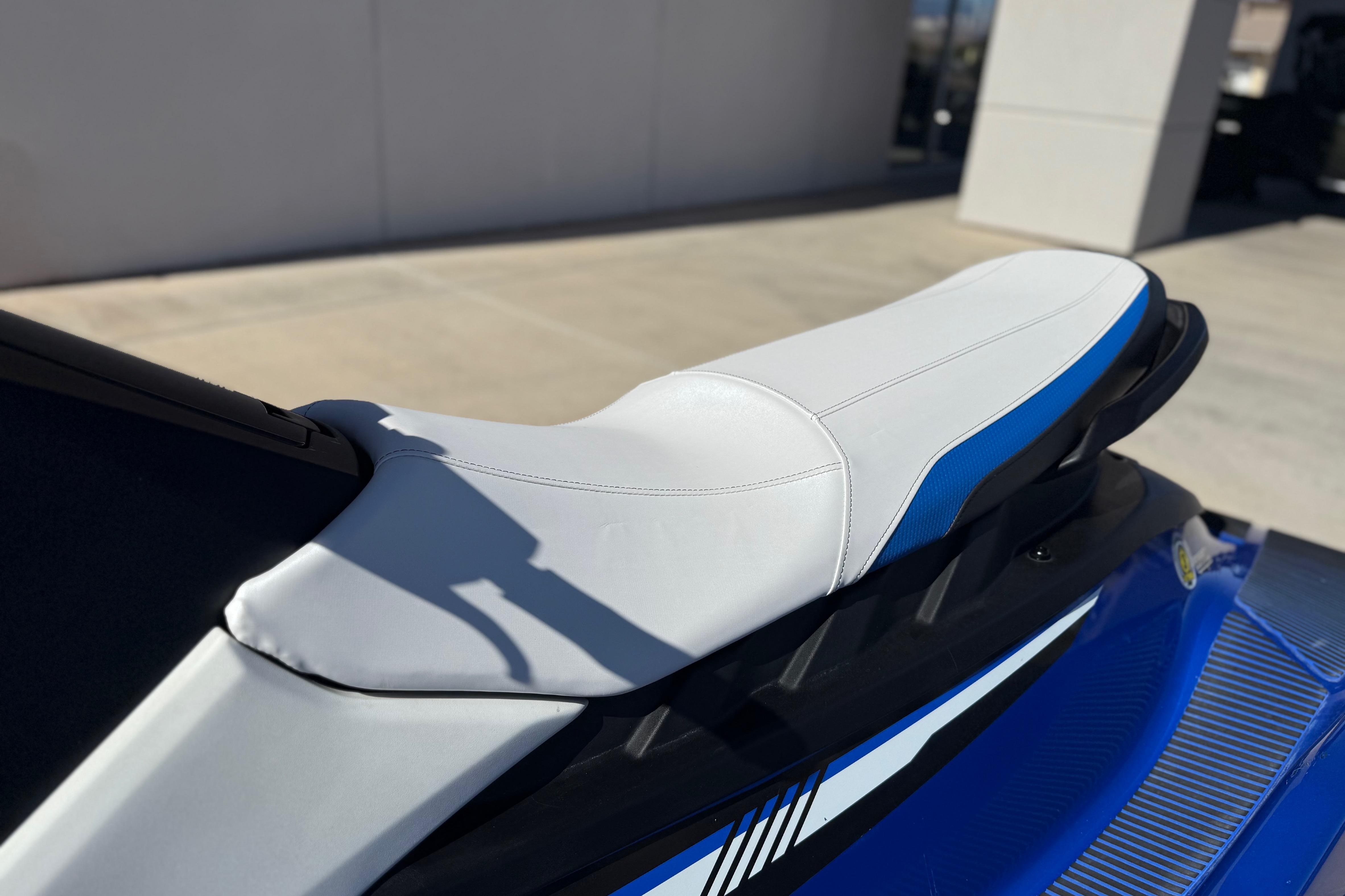 2017 Yamaha WaveRunner EX Deluxe with white and blue seat, parked outdoors.