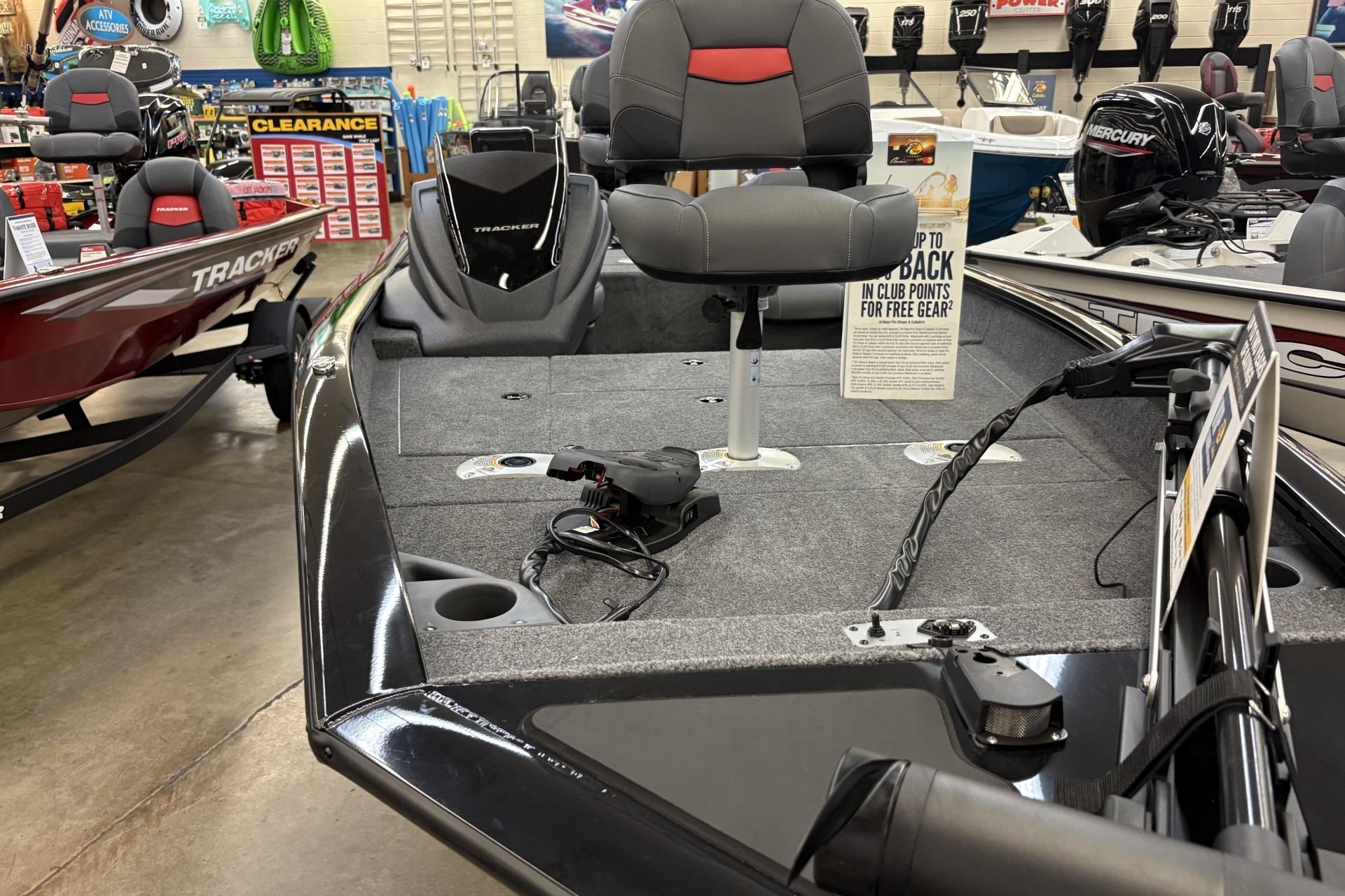 2026 Tracker Pro Team 175 Crappie Edition boat displayed in showroom with fishing gear.