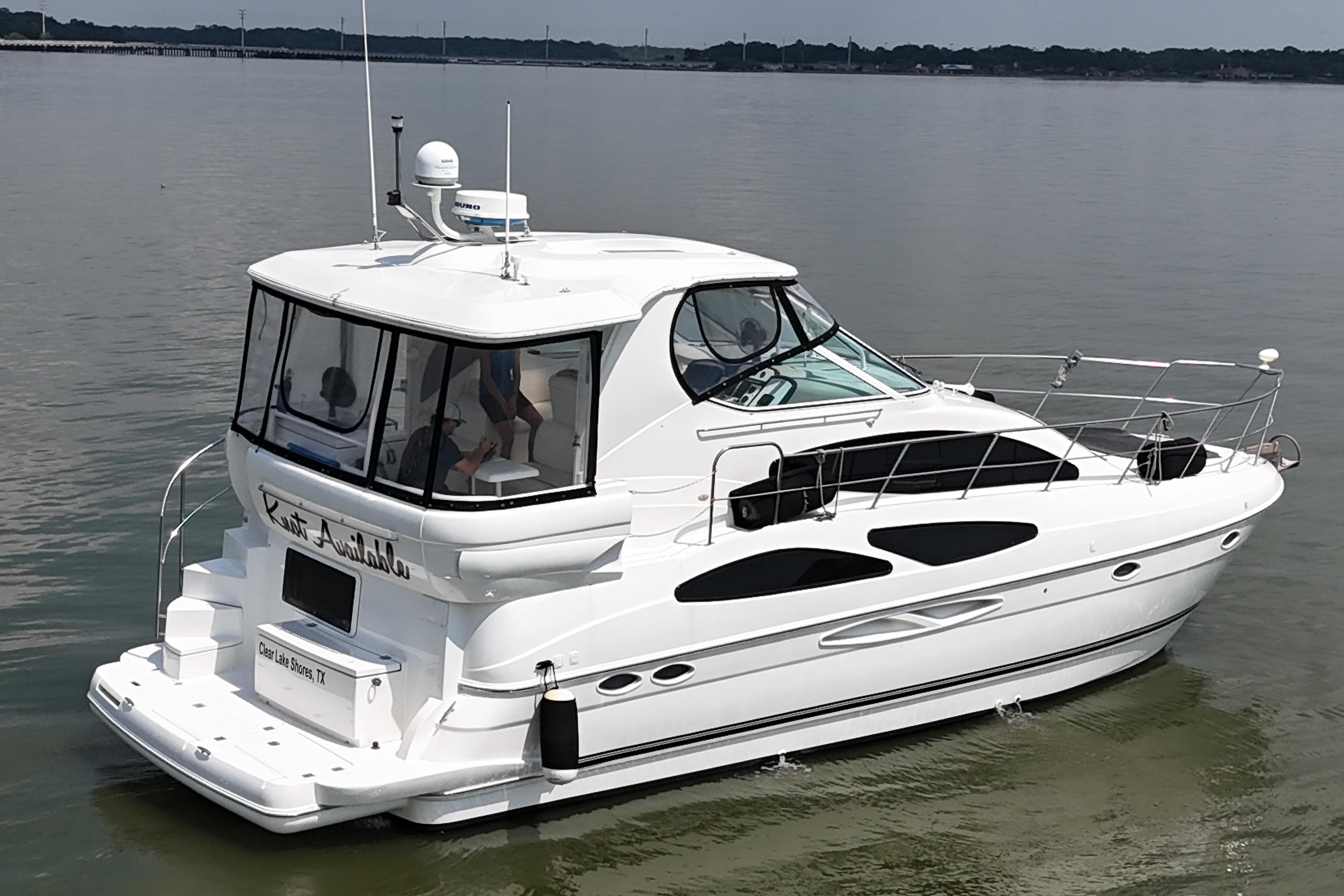 2004 Cruisers Yachts 405 Express Motoryacht on calm water, rear view.