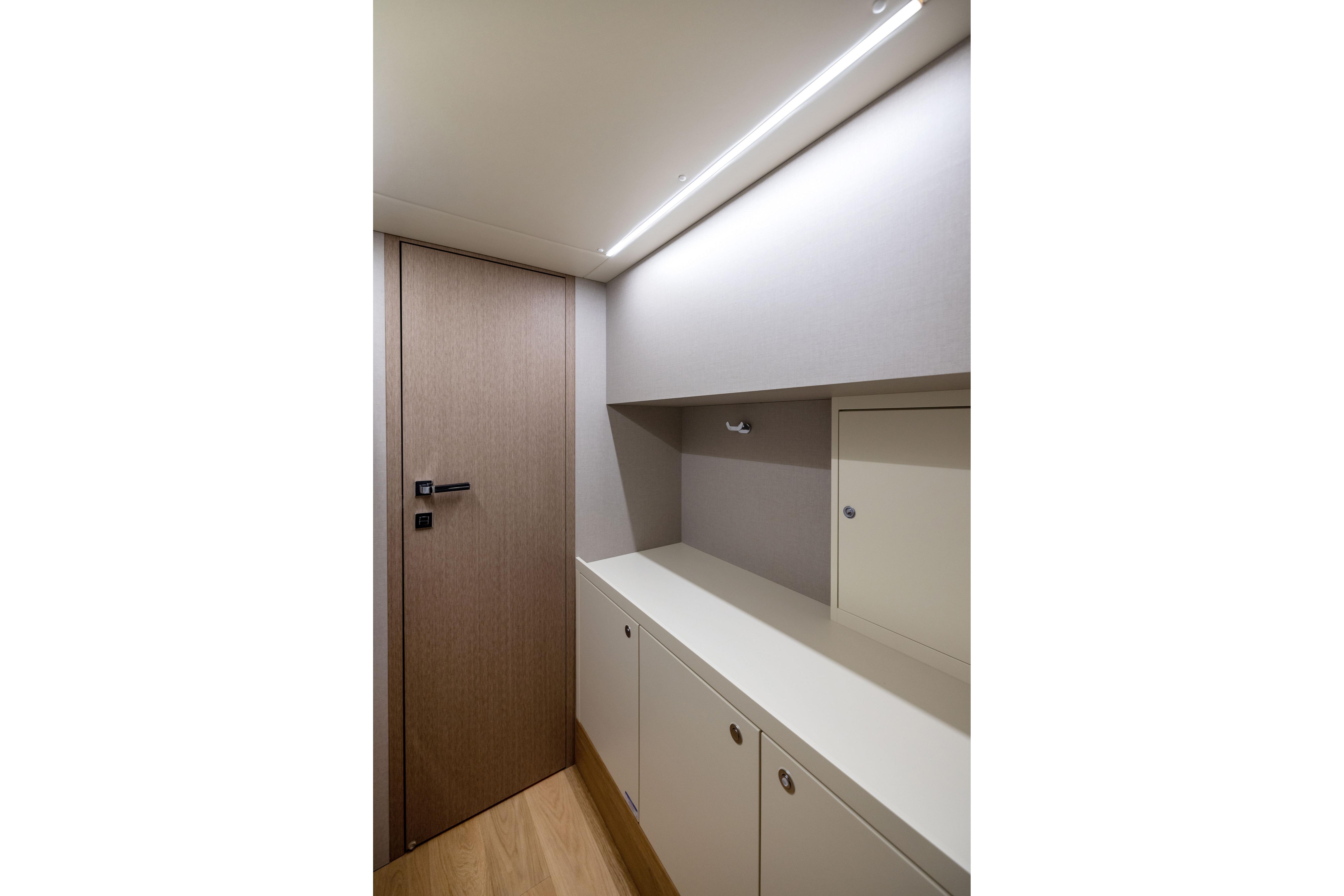 2024 Absolute Navetta 64 interior with modern cabinetry and sleek design.