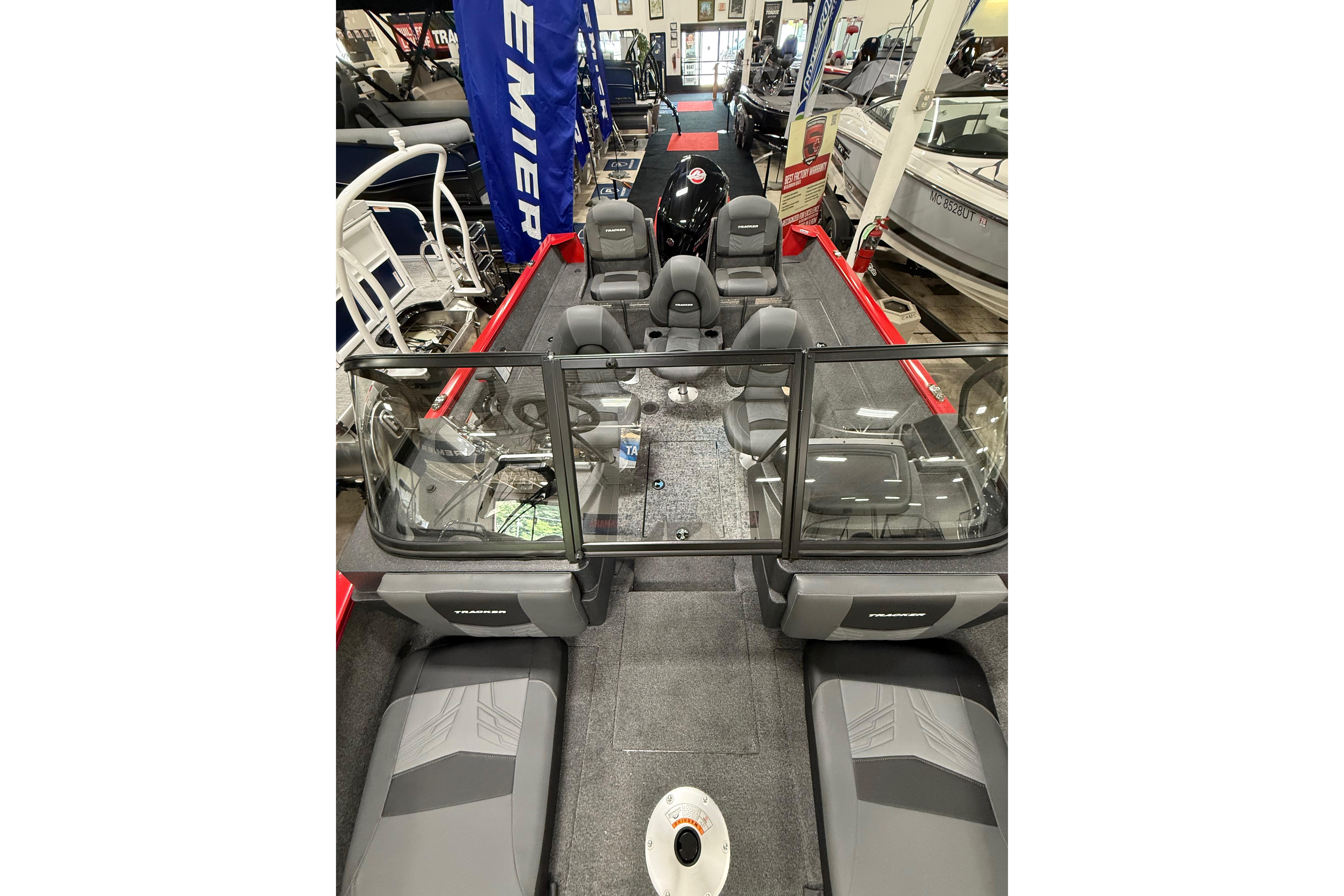 2026 Tracker Pro Guide V-175 Combo boat interior with seating and windshield in showroom.